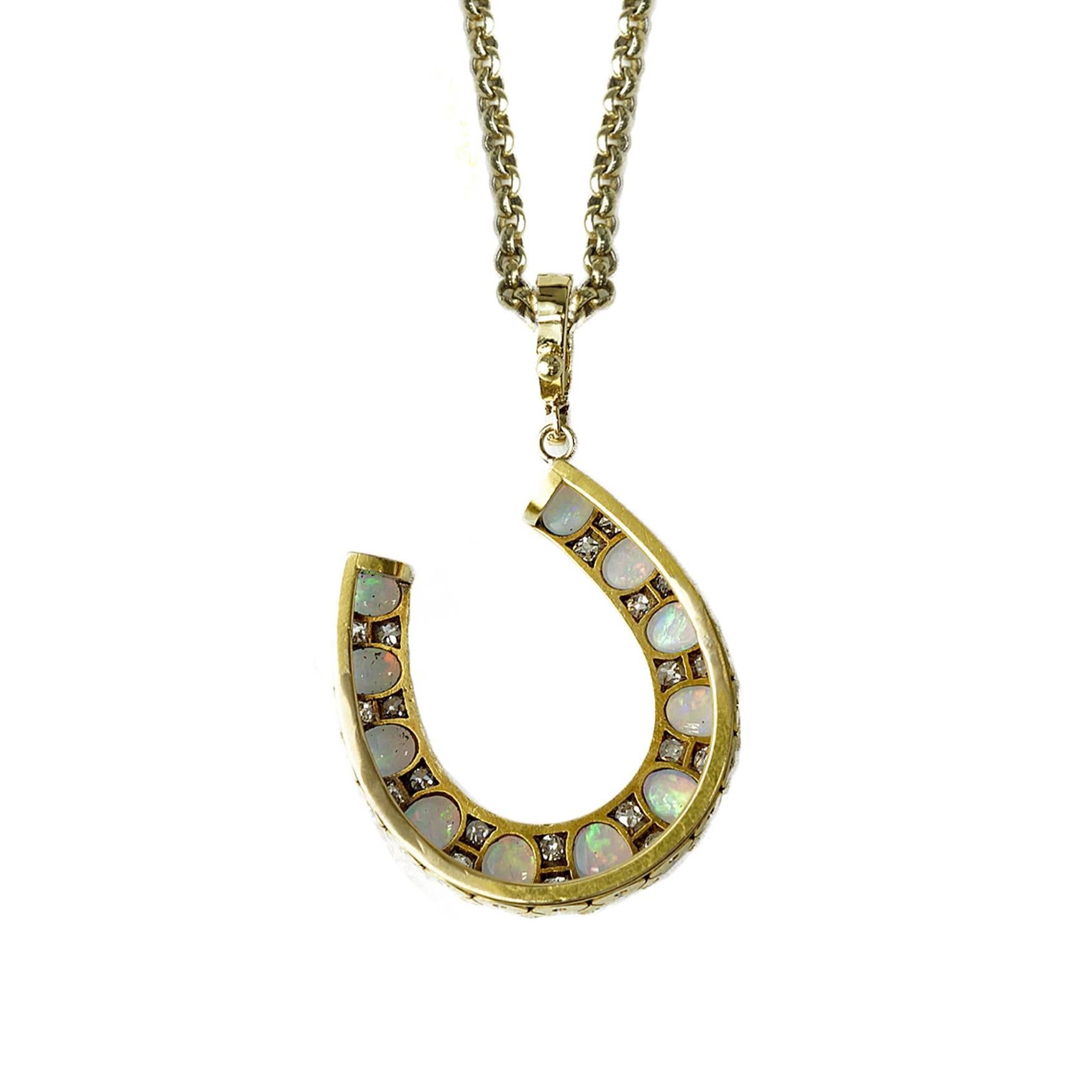 So hard to capture the true beauty of the opals in this gorgeous Victorian horseshoe!!  It has all the vibrant colors of the rainbow and they flash a different hue with each turn!!! Set between each oval opal are two old European cut diamonds. A