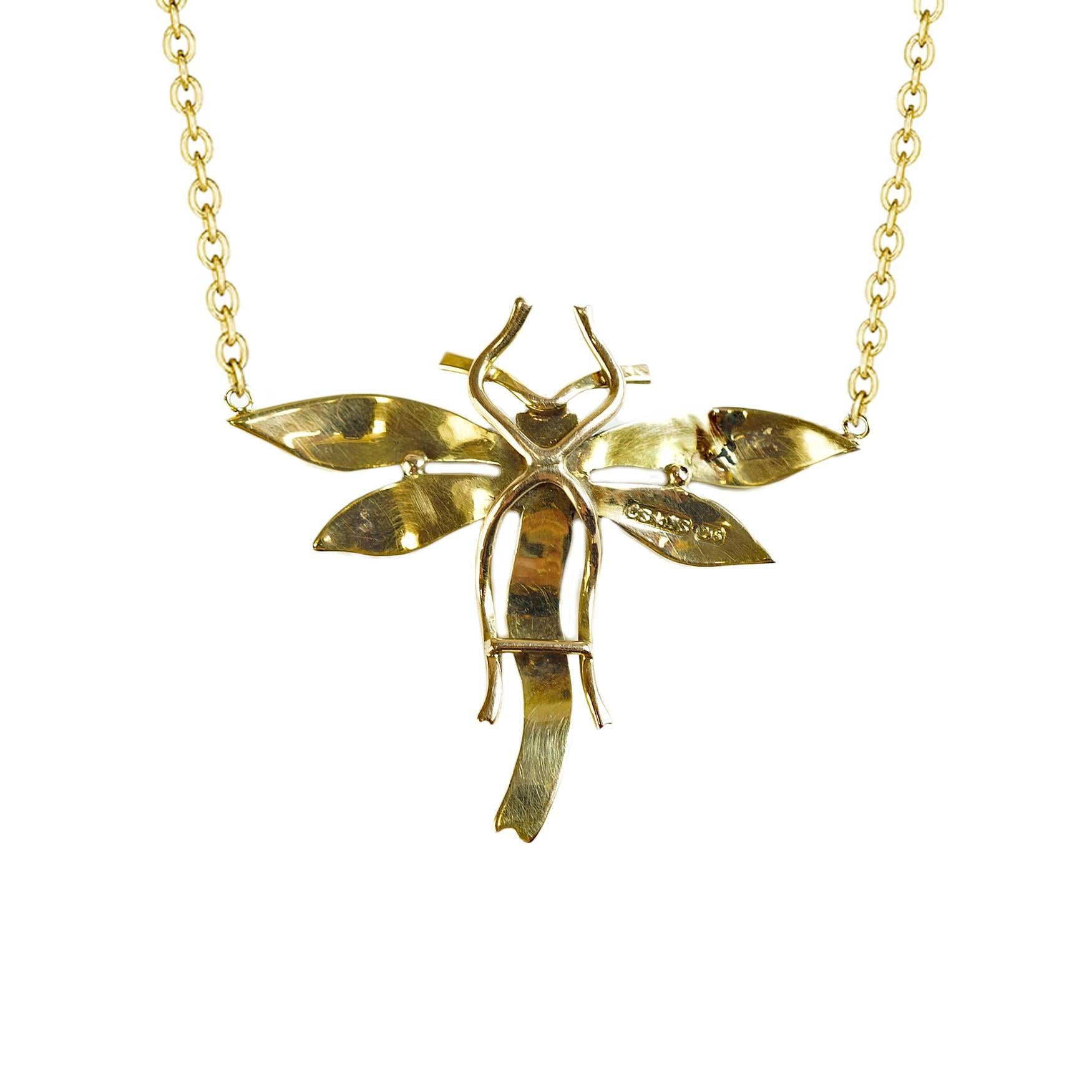 Edwardian seed pearl dragonfly necklace with a diamond center.  English 15 kt yellow gold connected to a 18" 18 kt yellow gold cable chain. 