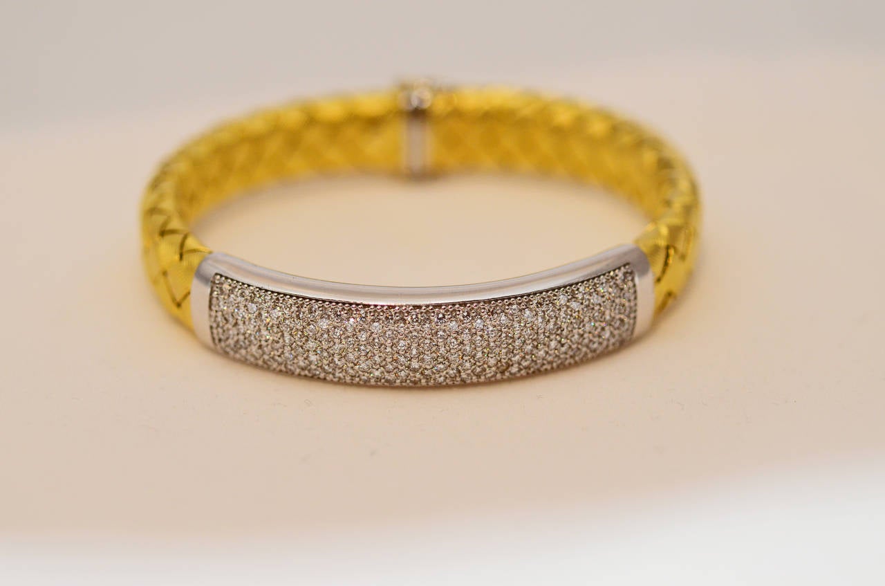 Italian gold woven bracelet with 2.50cts of diamonds. It's 14k yellow gold.