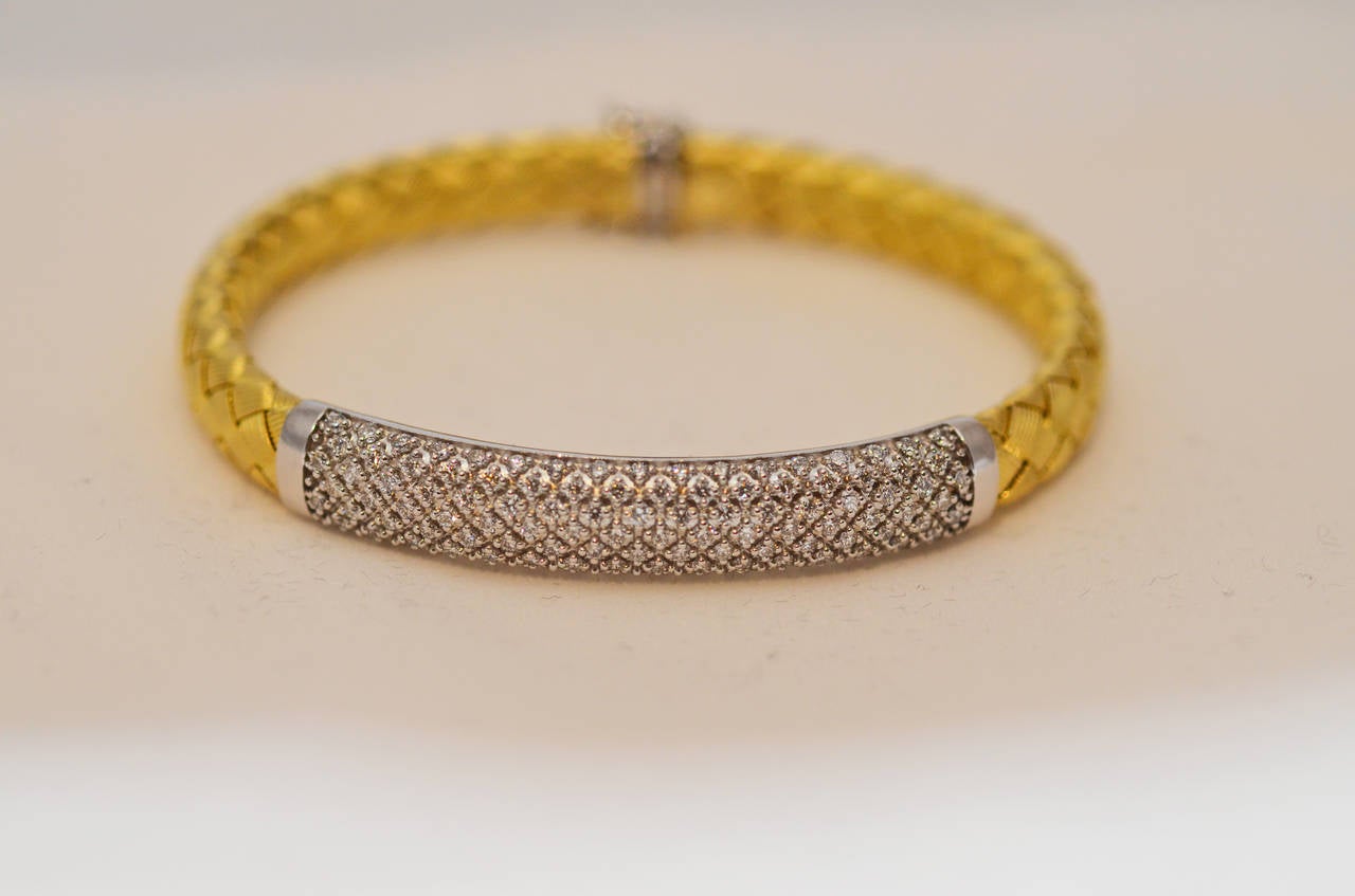 Italian gold and diamond woven bracelet in 14k yellow gold.  There are 2.50cts of diamonds.
