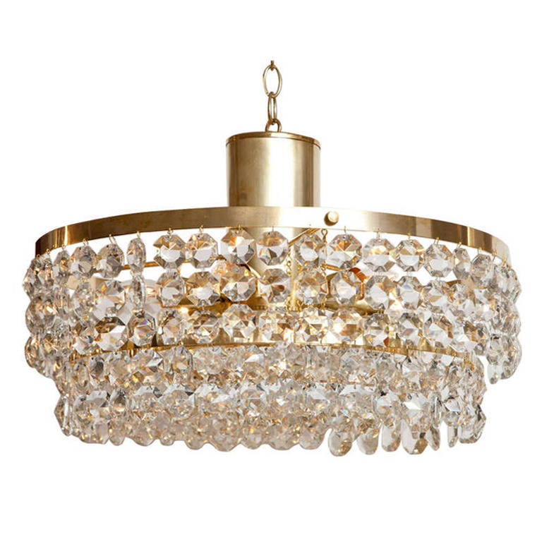A stunning fixture with dazzling crystal beads suspended from four brass tiers. From a villa in the south of Sweden, this piece has been newly re-wired for use in the US.