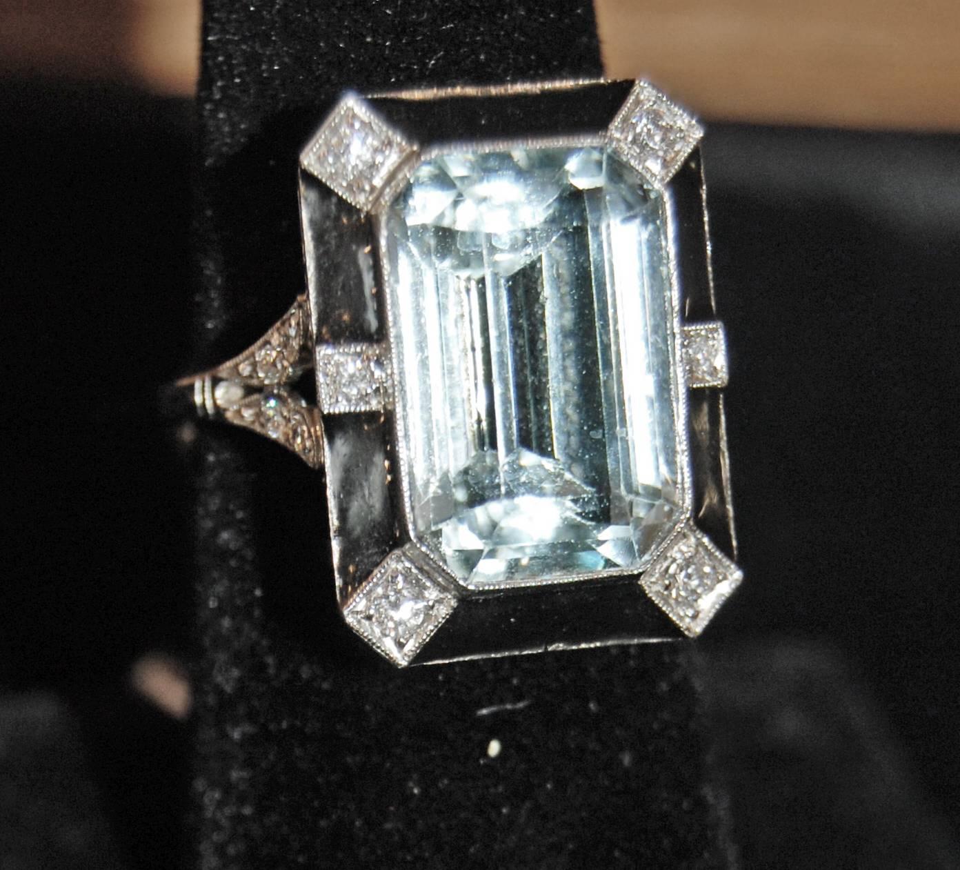 12 Carat Aquamarine set in Platinum with Natural Onyx and Full Cut Diamonds
.85 carat diamonds
.70 Natural Onyx
Size-8