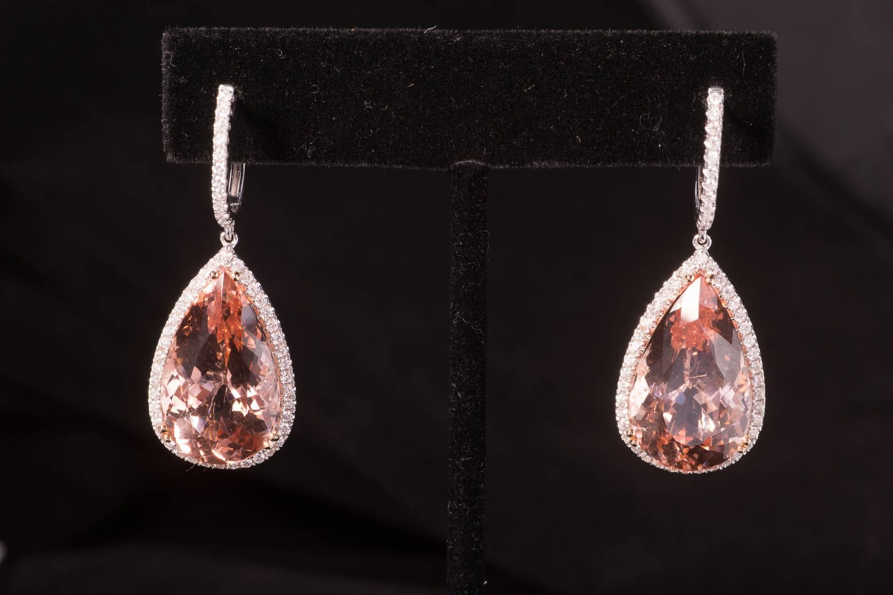 Magnificent, classic and contemporary Morganite and Diamond earrings. There are  28.74cts of Morganite, 1.05cts of  sparkling white Diamonds. The earrings are set in 18k rose gold.
Morganite is from the Beryl family of gems which the Emerald is