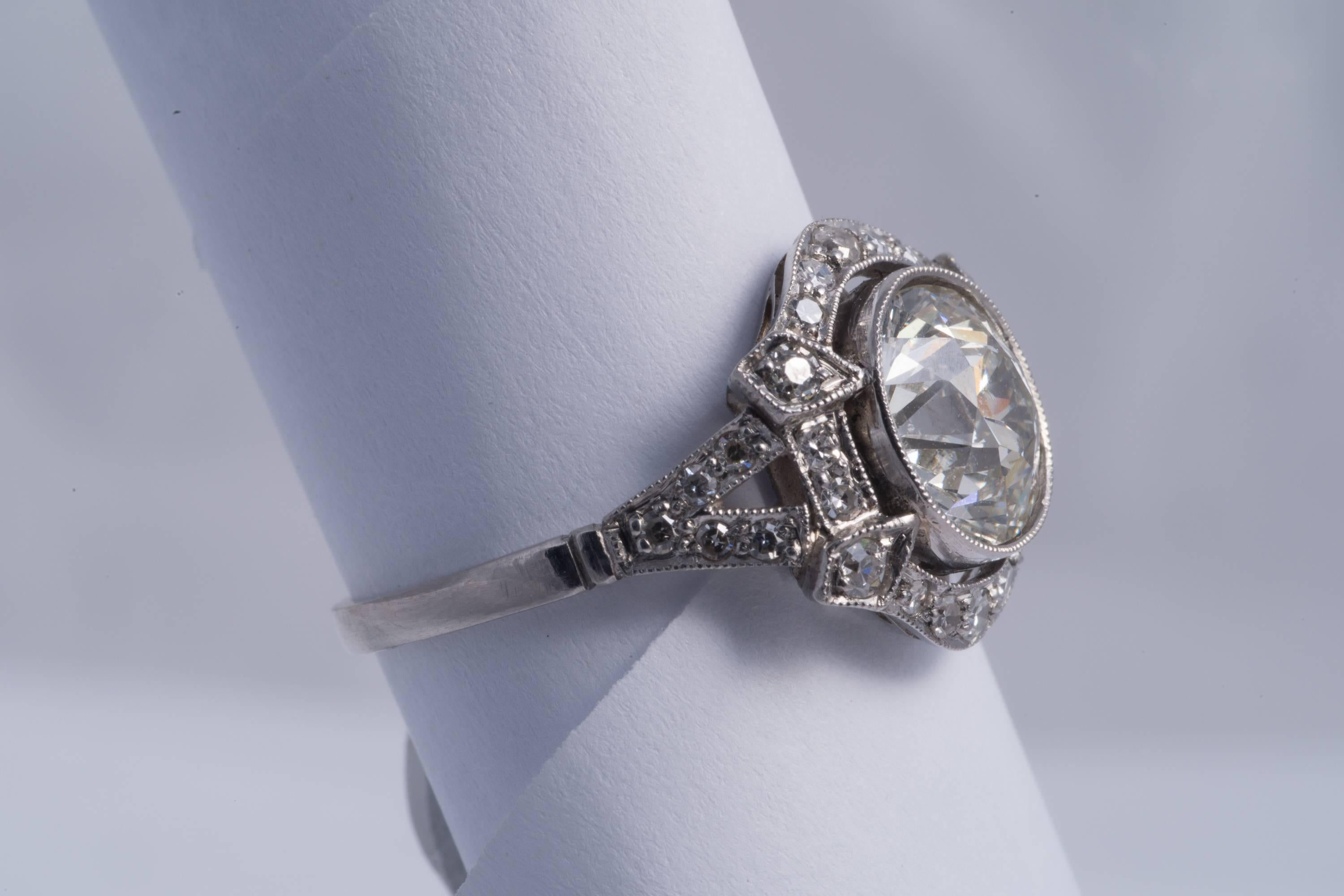 Beautiful Old Mine Cut Diamond Ring in Platinum Center Diamond 2.75 cts VS2 H-I color.
There are 28 single cut diamonds approx. 1.00 cts. VS clarity, G-H color. 