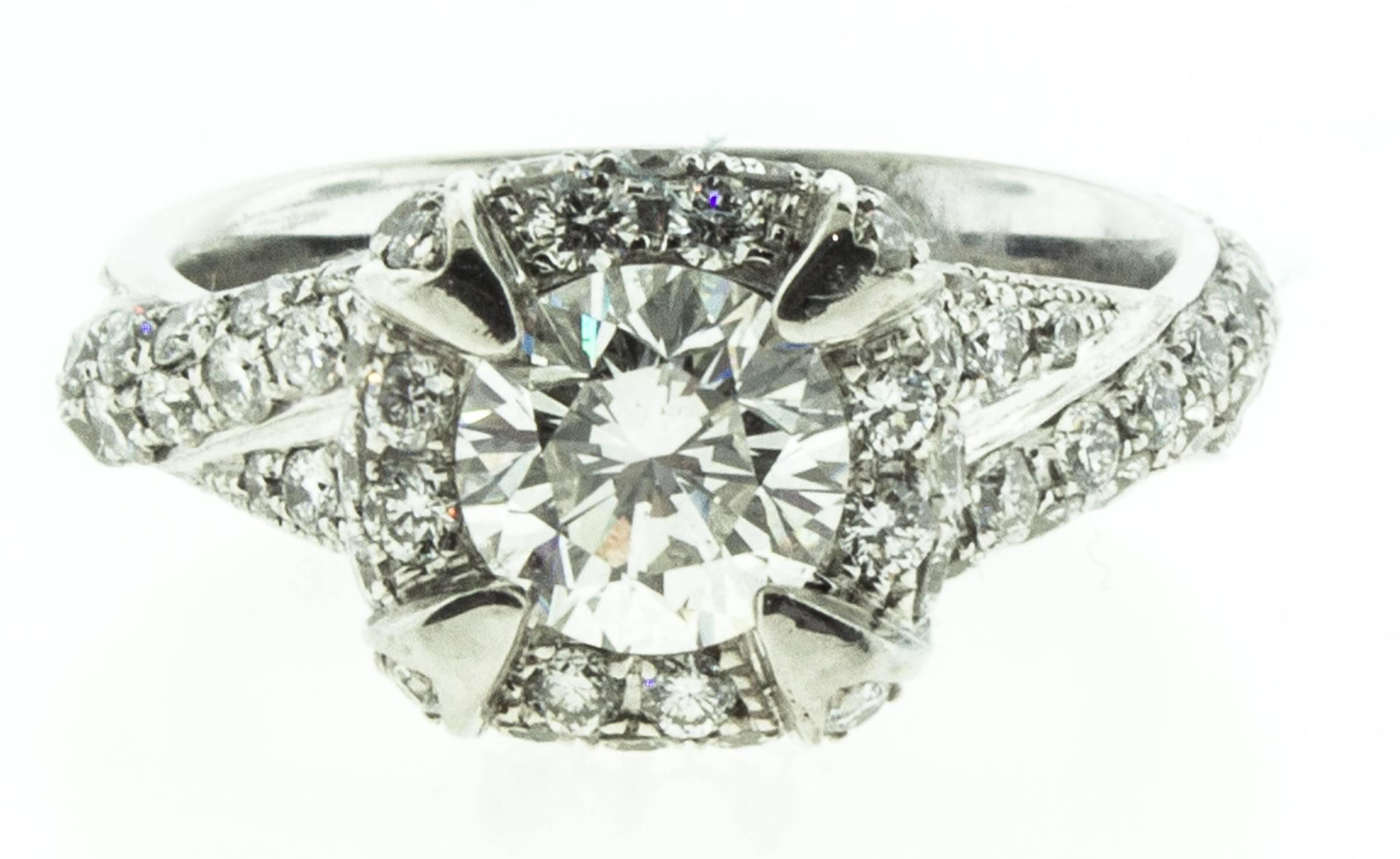 Platinum engagement ring elegantly designed and signed by Danuta, a Santa Fe based designer.  This beautiful ring is set with center Dia GIA certified 1 carat to center diamond G color VS1 clarity, and surround by pave diamonds of 1.5 carat total,