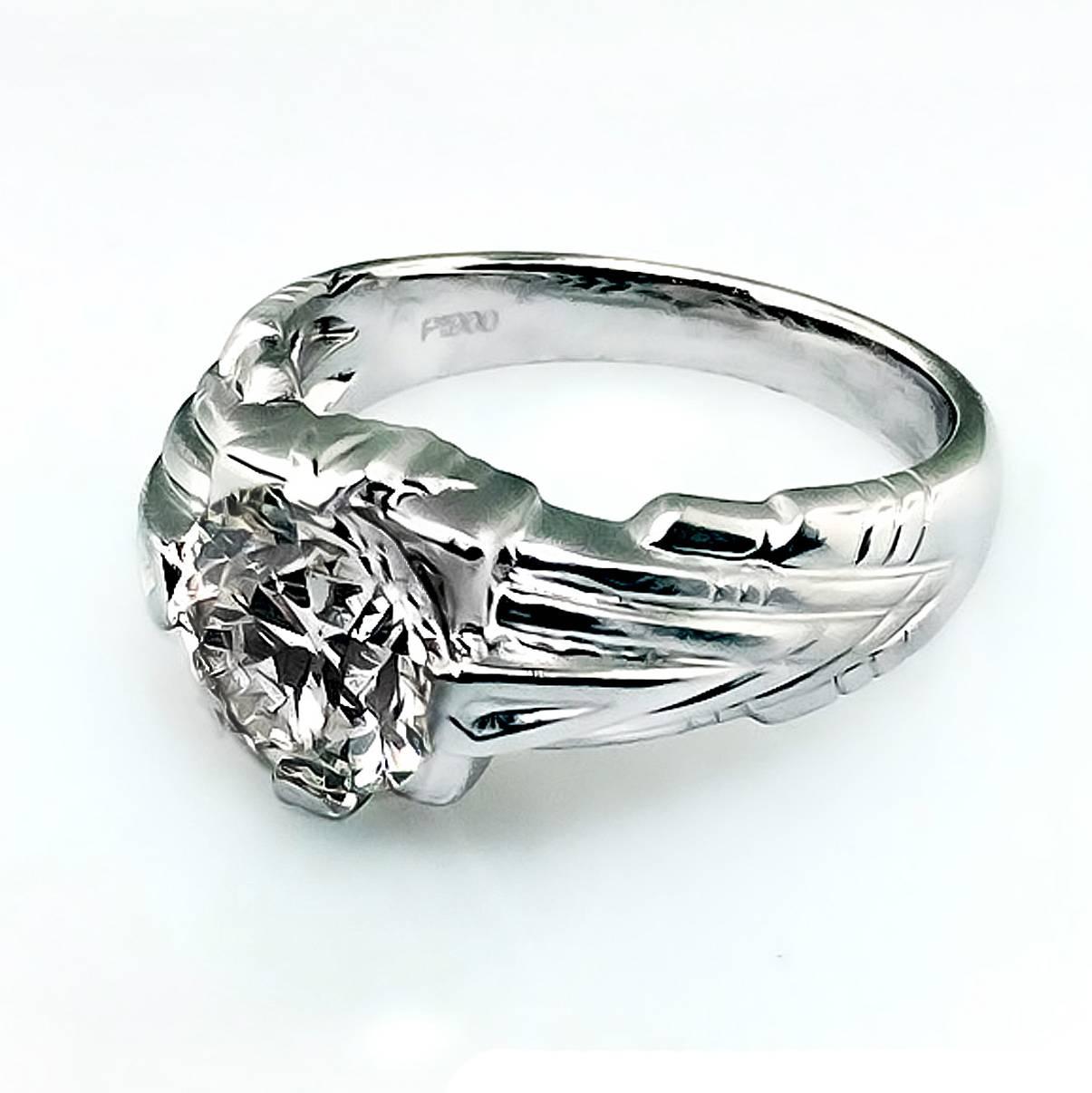 Platinum engagement ring designed by JCK Award Winner Jonathan Duran, of Santa Fe, New Mexico. This one-of-a-kind gorgeous platinum ring is set with a 2.76 carat, brilliant cut round diamond O color VS2 clarity.

 Notice the extra intricate