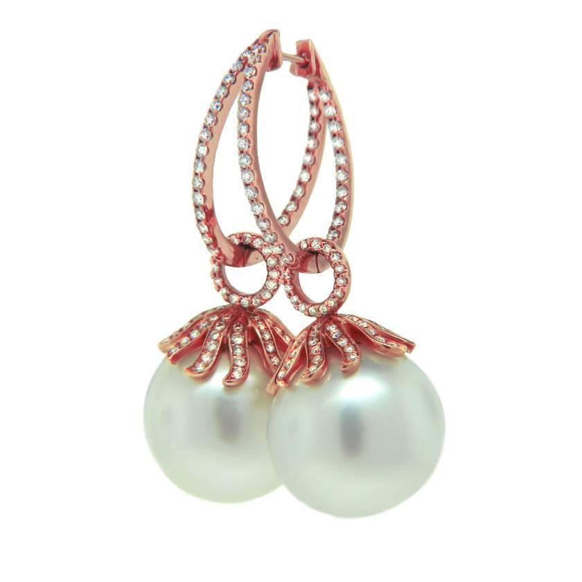 This stunning pair of earrings was designed by local Santa Fe based jewelry artist Danuta and feature two large 16 millimeter South Sea Pearls. The 18 karat rose gold is a perfect contrast to the bright pearls and make these earrings stand out in a