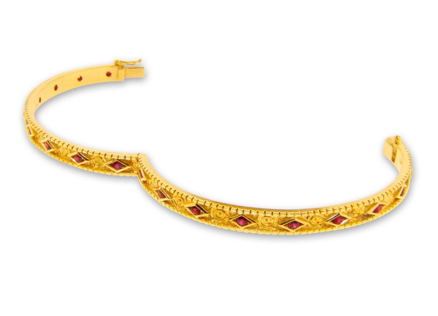 Modern .95 Carat Ruby Yellow Gold Celtic Carving Design Bangle Bracelet For Sale