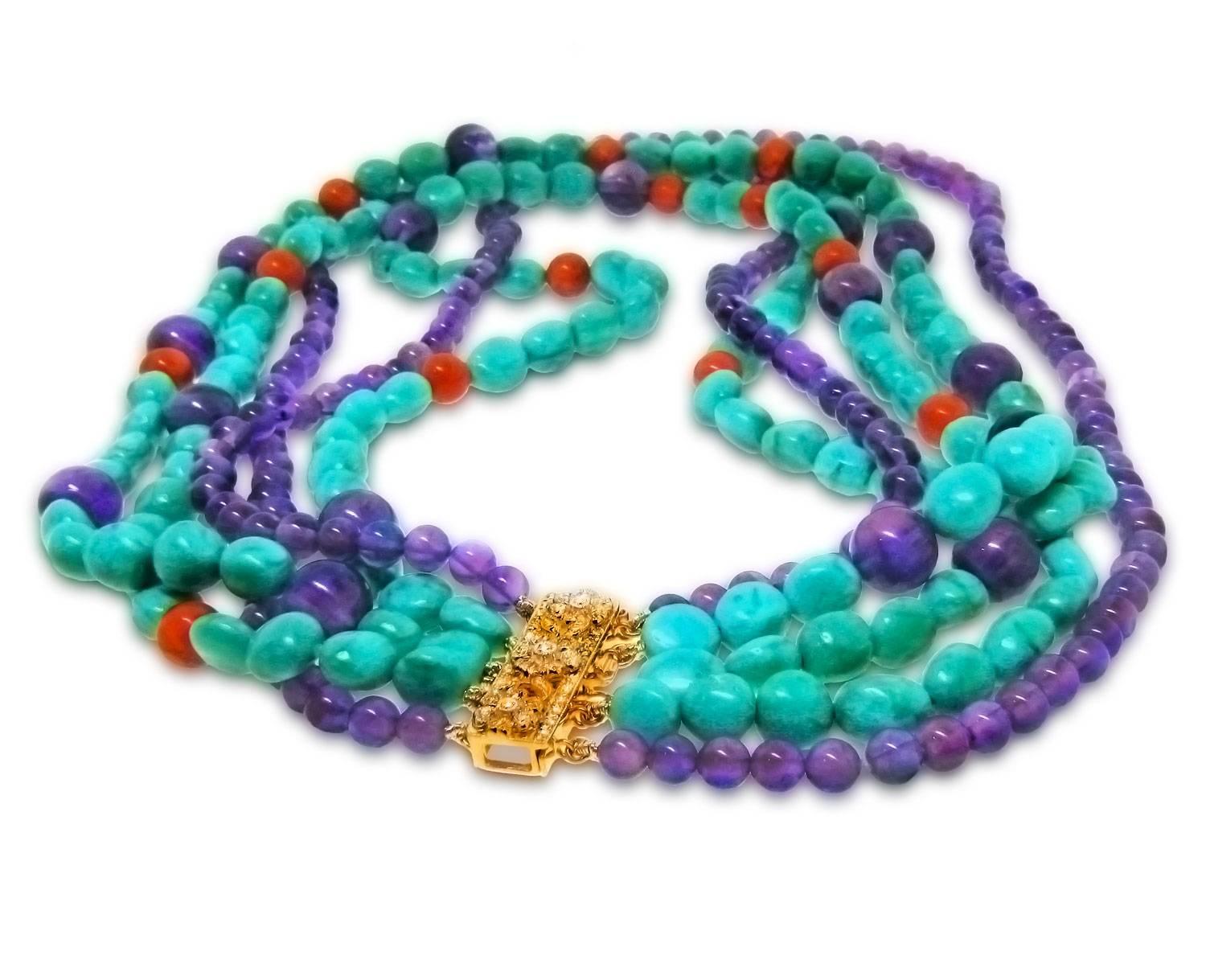 This glamorous five strand beaded necklace shows off bright Summer colors in a bold design. Beautiful Kingman Turquoise really pops against the interspersed red coral while round Amethyst beads provide interesting contrast. 

A stunning clasp of 18