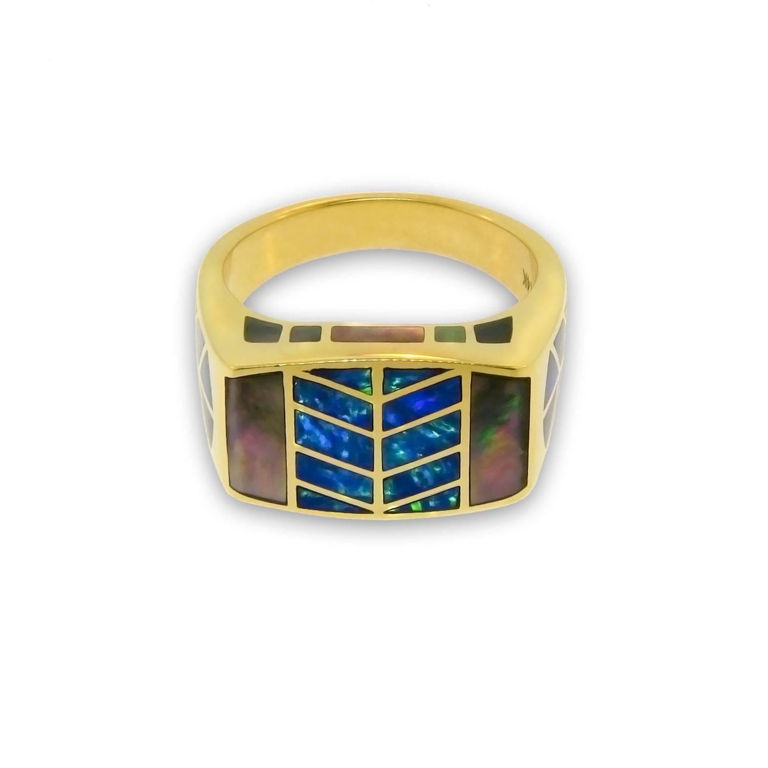 A stunningly unique signet ring by Santa Fe based International Award Winning Designer Jonathan Duran. This 14 karat yellow gold ring features a geometrical rendition of a hawk feather pattern to represent the Element Air.

The hawk feather motif of