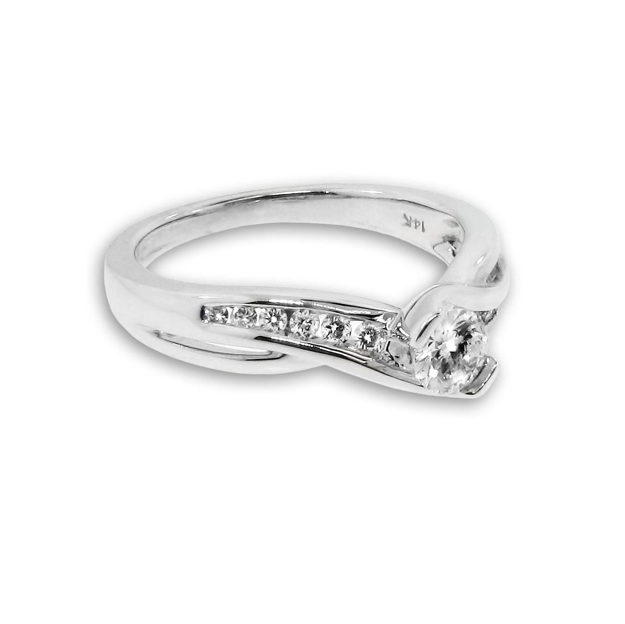 Edwardian Sparkling White Diamond 14 Karat White Gold Engagement Ring Flowing Design For Sale