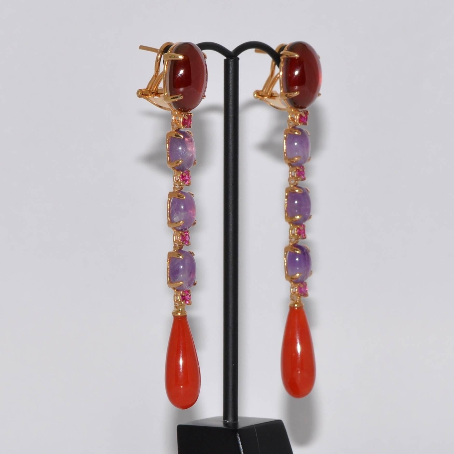 Discover this Coral, Garnet, Amethyst and Ruby on Yellow Gold Chandelier Earrings.
Coral
Garnet 
Amethyst 
Ruby 0.56 Carat
Yellow Gold 18 Carat