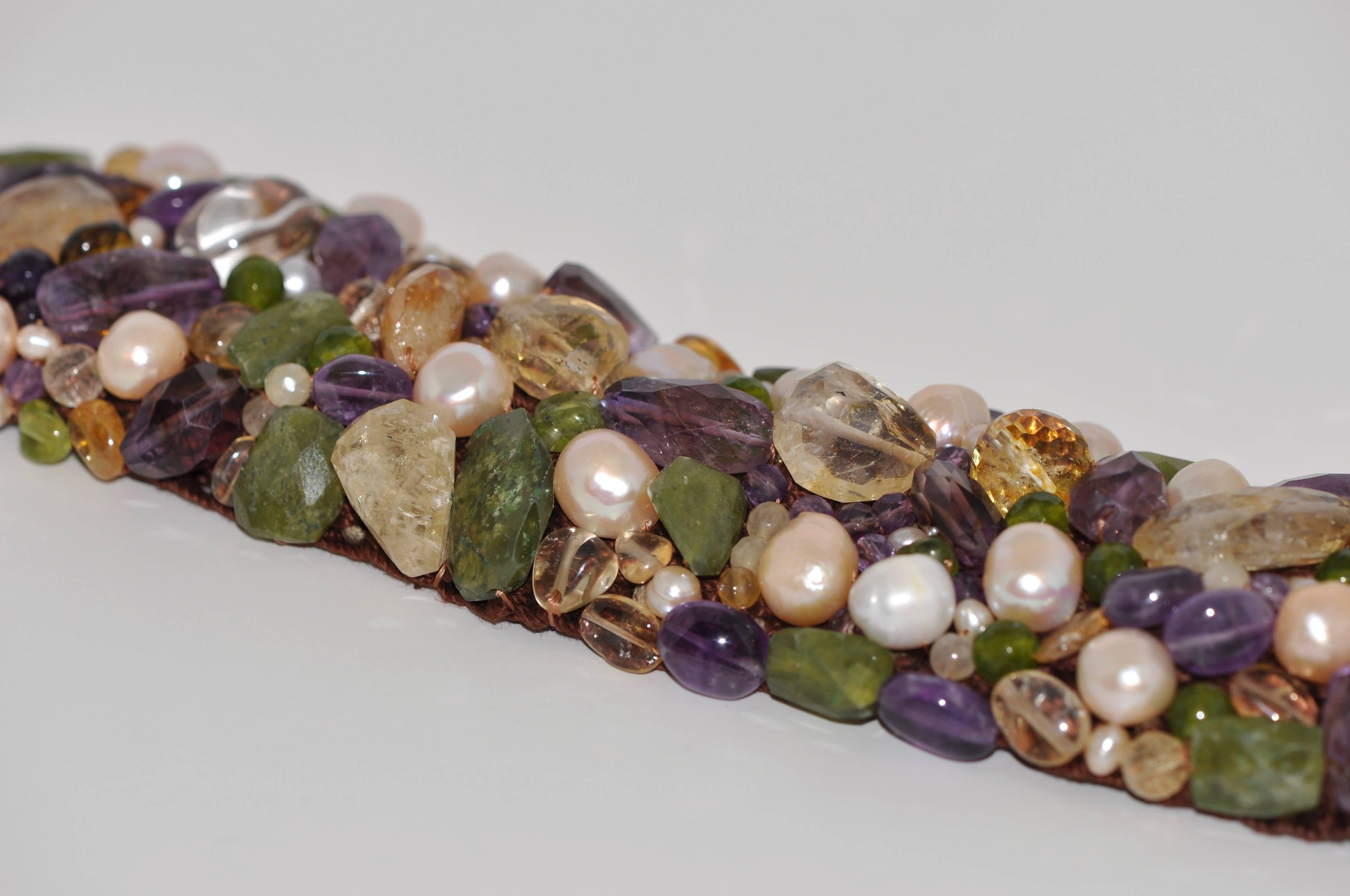 Discover this Amethyst Citrine Peridot and Freshwater Pearls Artisanal Cuff Bracelet.
Amethyst
Citrine
Peridot
Freshwater Pearls
This Cuff Bracelet is handmade.