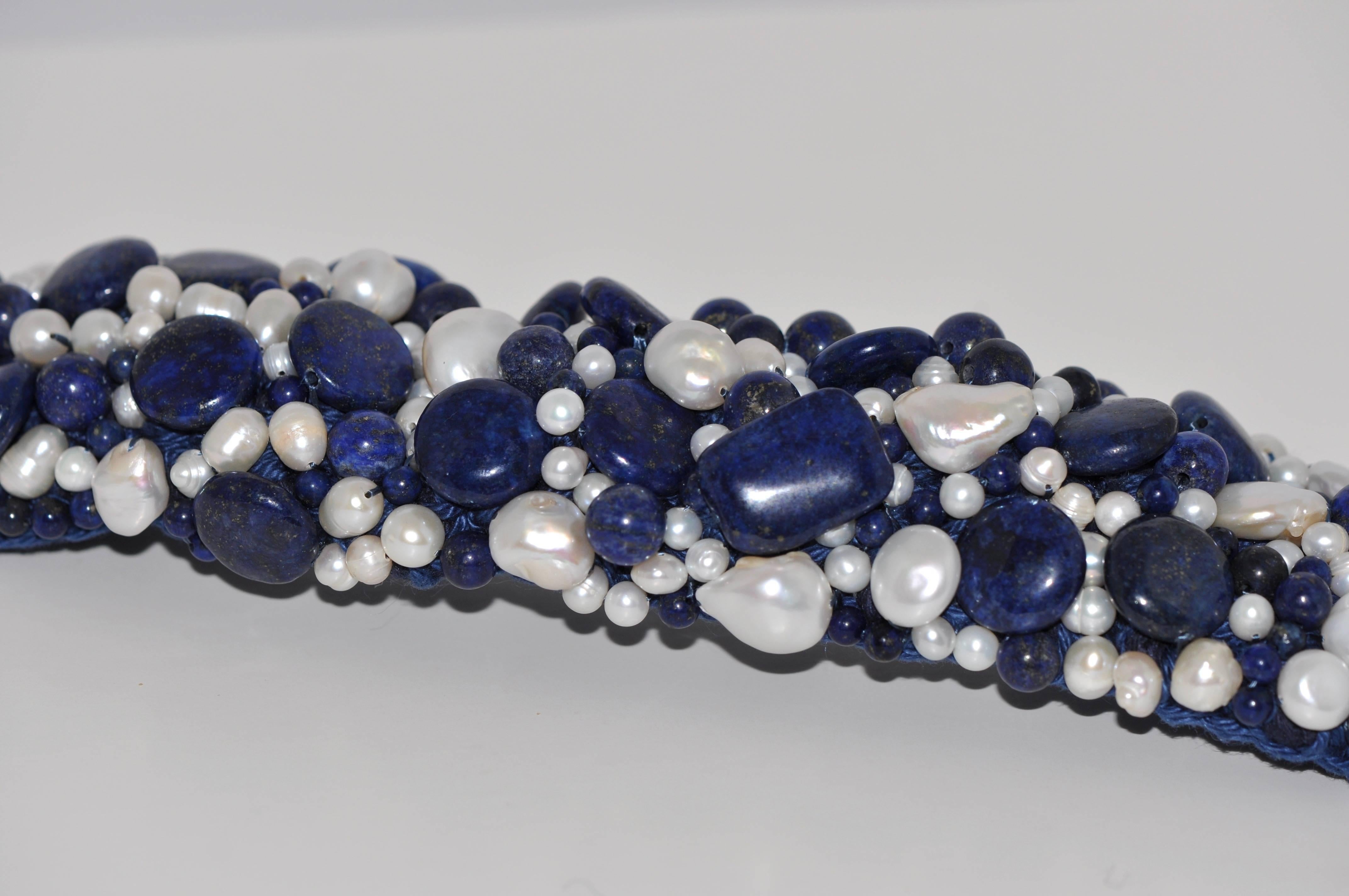 Discover the Lapis Lazuli and Freshwater Pearls Artisanal Cuff Bracelet.
Lapis Lazuli
Freshwater Pearls
This Cuff Bracelet is handmade.