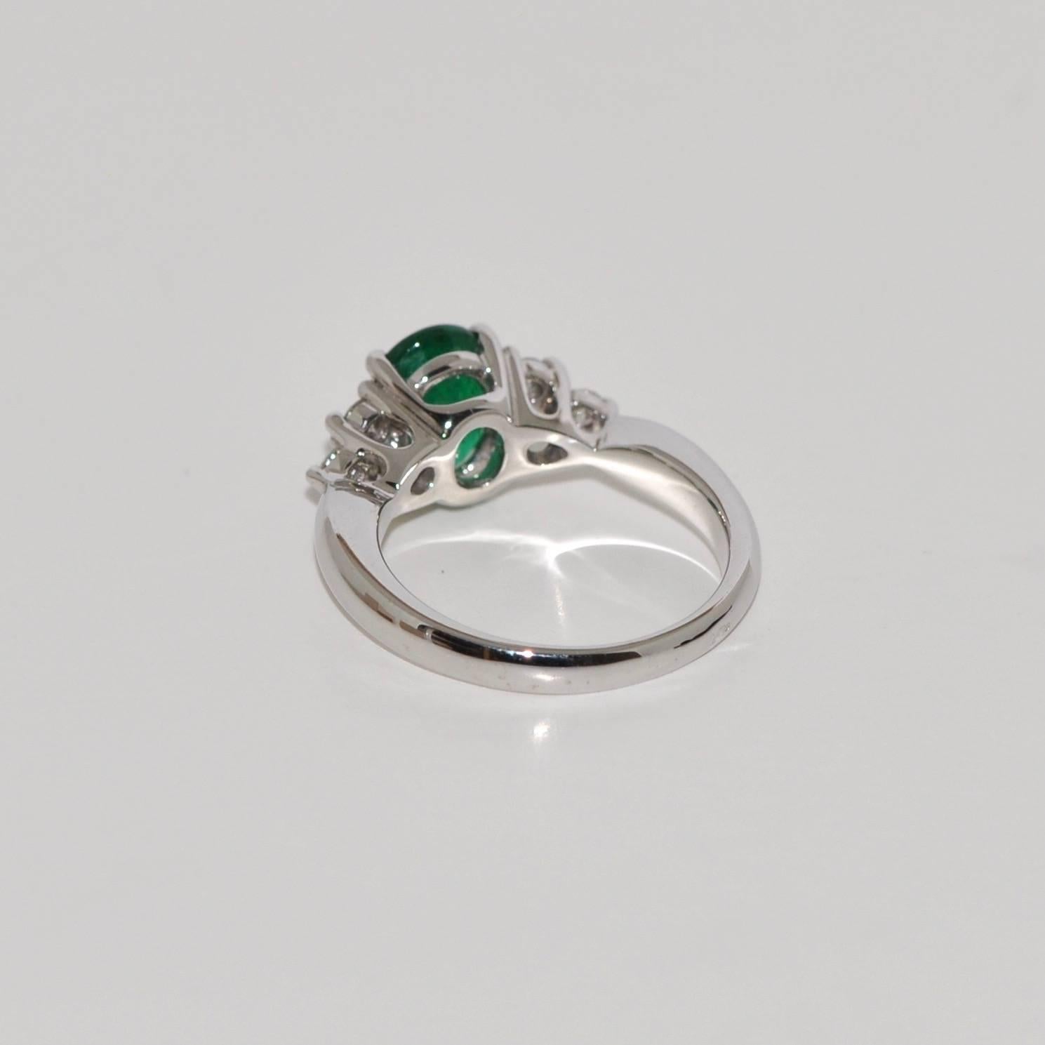 Oval Cut Emerald and White Diamonds White Gold Engagement Ring