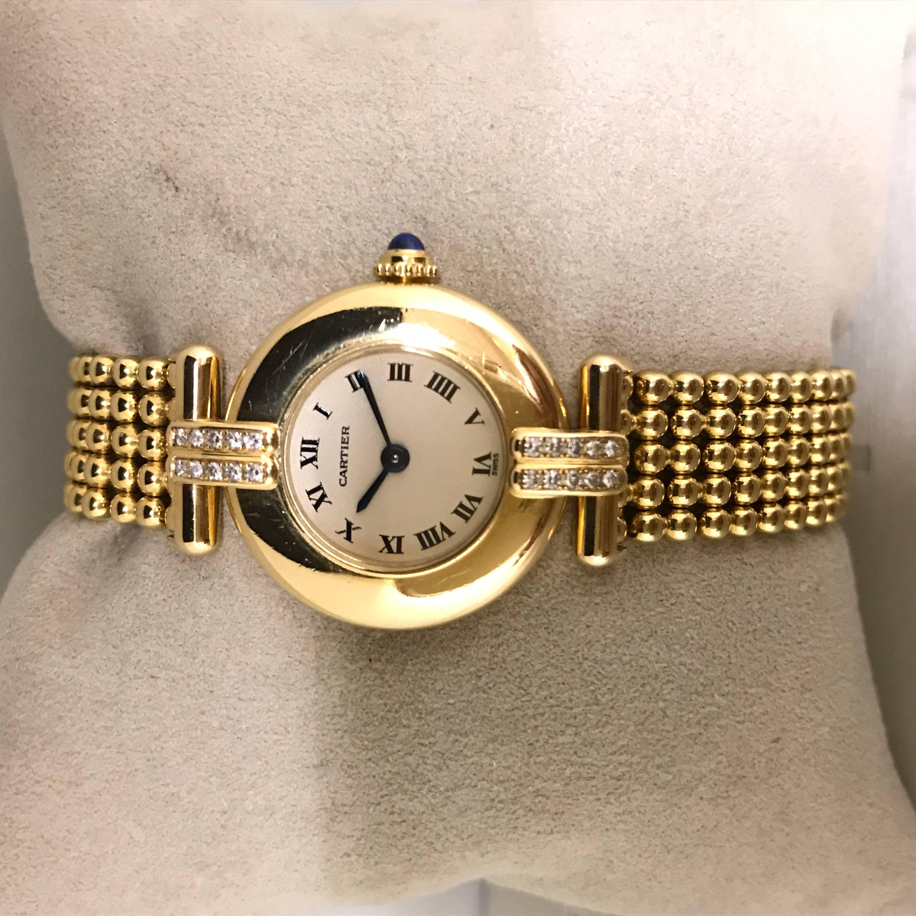 Discover this Cartier Yellow Gold Paving Diamonds Colisee Quartz Ladies Wristwatch.
Watch CARTIER COLISEE ,movement ref 1923 ,dial color creme ,index roman numerals..The fasteners are set with 20 diamonds.
articulated bracelet ,clasp gold signed