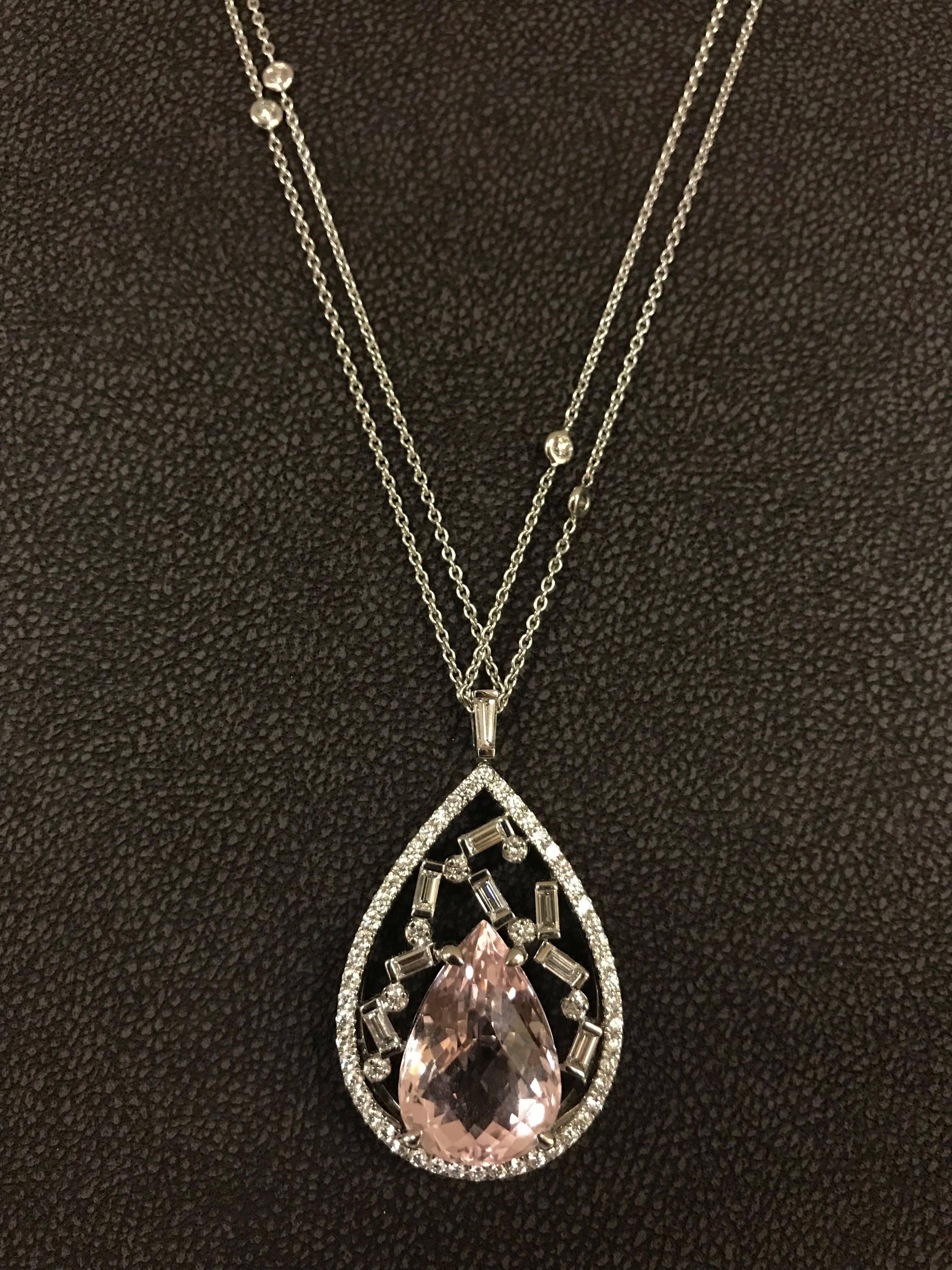 Kunzite Shaped Peach 11,12 Carat and Diamonds Baguettes White Gold Necklace.
Kunzite Shaped Peach 11,12 Carat
Diamonds Baguettes FG/VSSI 0,61 Carat 
Diamonds Brilliants FG/VSSI 1,11 Carat
Diamonds Tapers FG/VSSI 0,10 Carat 
Double Chain with