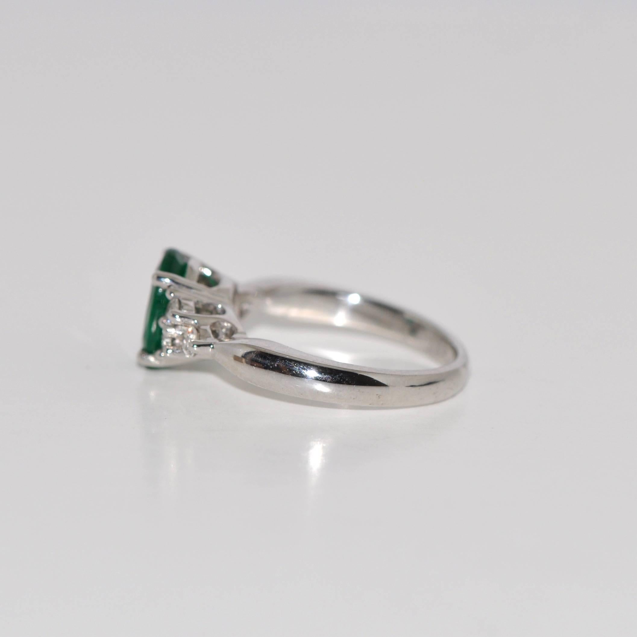 Women's Emerald and White Diamonds White Gold Engagement Ring