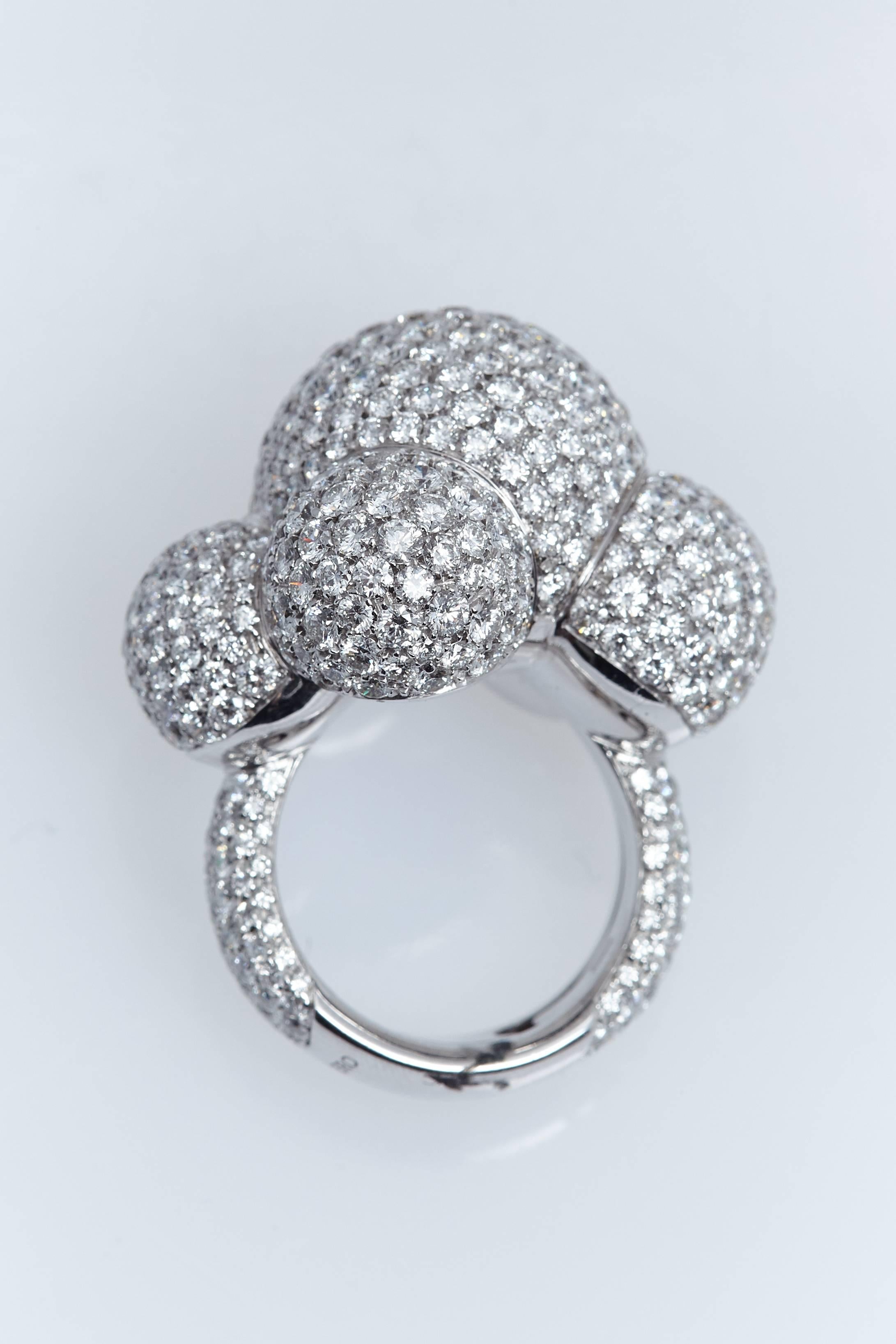 Palmiero "Bubbles" ring in 18 karat white gold  The design consist of six bubbles of various sizes, all with pave-set white diamonds.  The ring also has pave-set diamonds going down the shank. The total weight of diamonds is 13.87 carats.