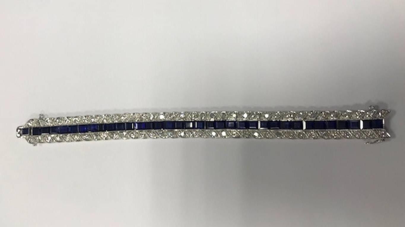 Platinum and Sapphire Diamond Bracelet with 77 round diamonds weighing approximately 5 carats and 24 square sapphires with an approximate weight of 20 carats. The bracelet measures approximately 7 1/8