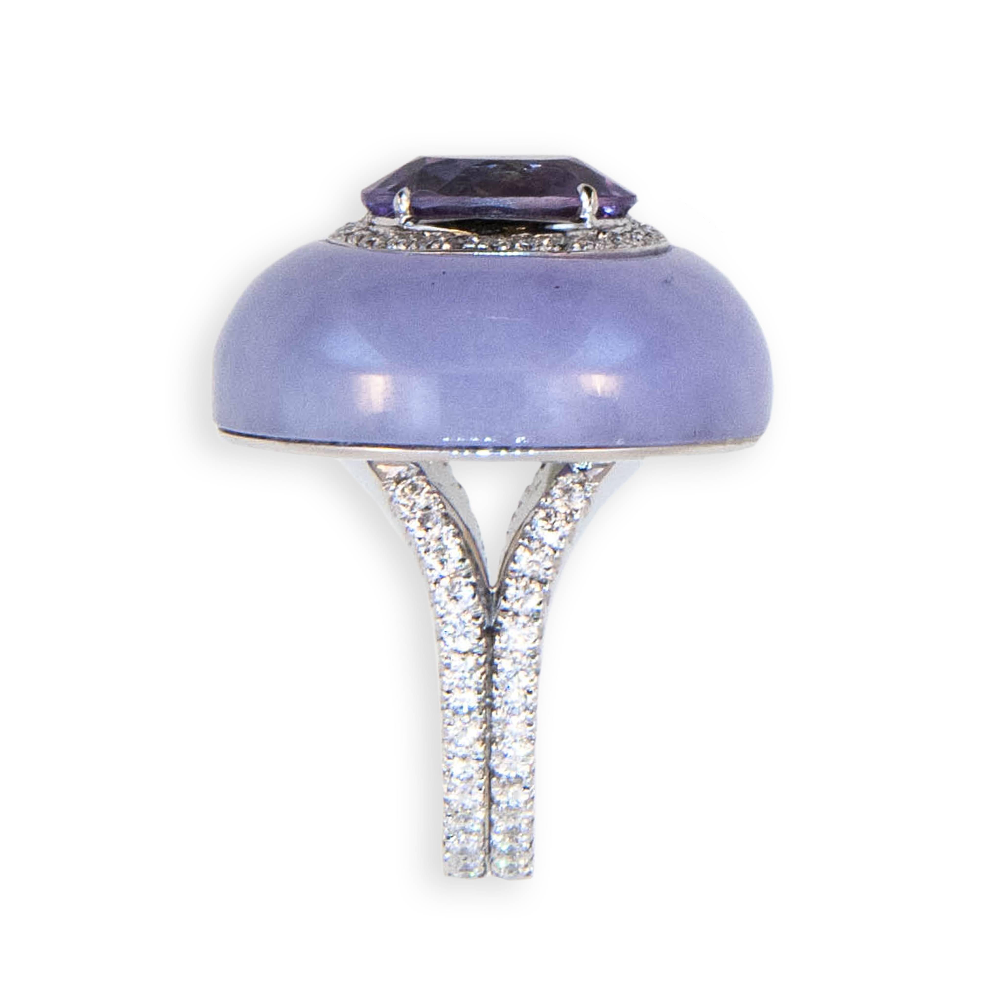 18 karat white gold ring set with one oval amethyst approximately 3.84 carats surrounded by (28) micro-set diamonds , split shank is set with (56) diamonds (84) Diamonds total 1.12 carats total weight  Amethyst and surrounding diamonds are set into