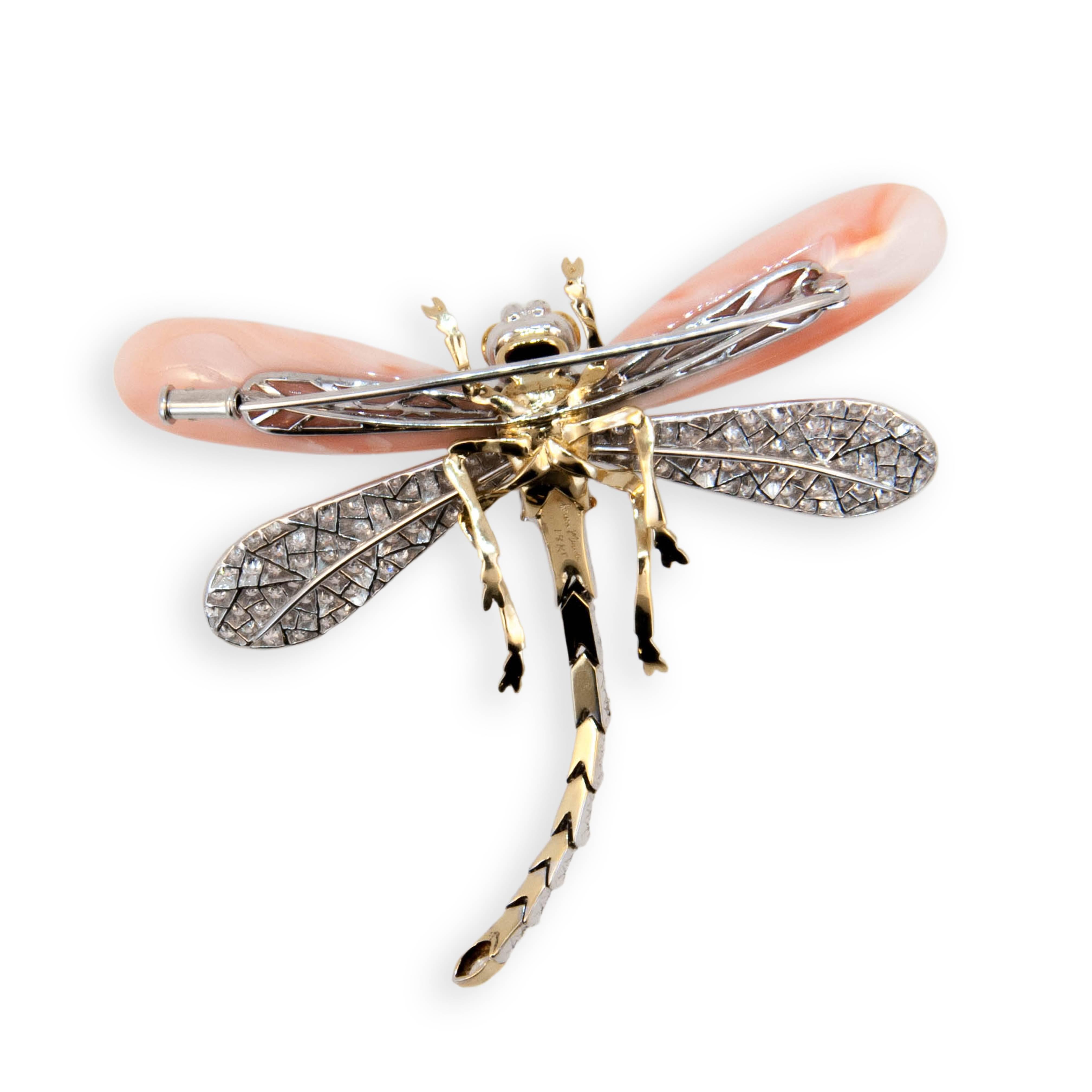 18 karat yellow and white gold Dragonfly brooch set with (2) approx. 6.80 gram total weight. Angel Skin Coral drops for front wings,back wings,body and tail set with 199 round Diamonds 2.38 carats total weight. Tip of tail is set with (1) Marquise