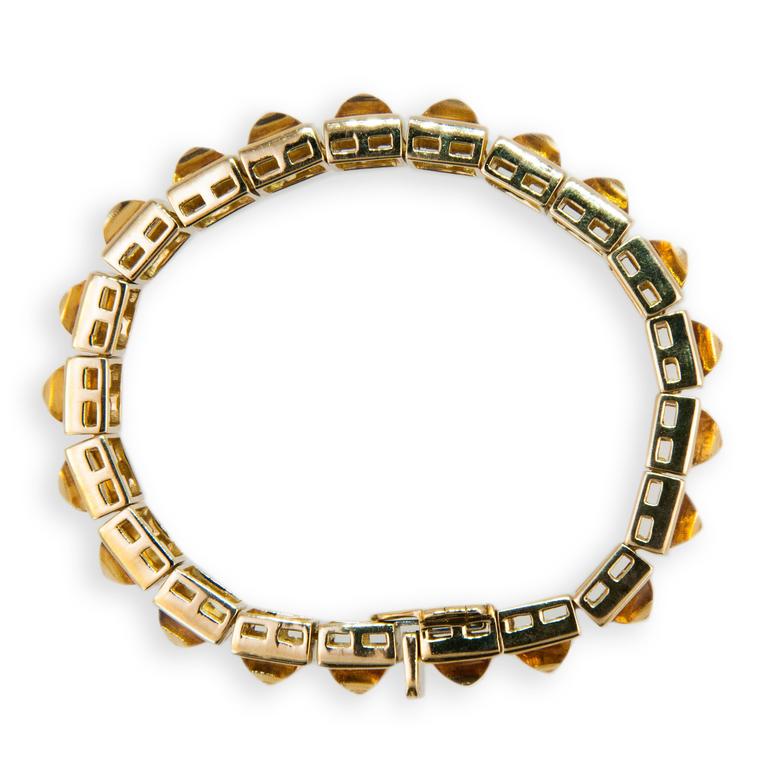 18K yellow gold sugarloaf cut citrine bracelet. 7 1/8 inches long. 