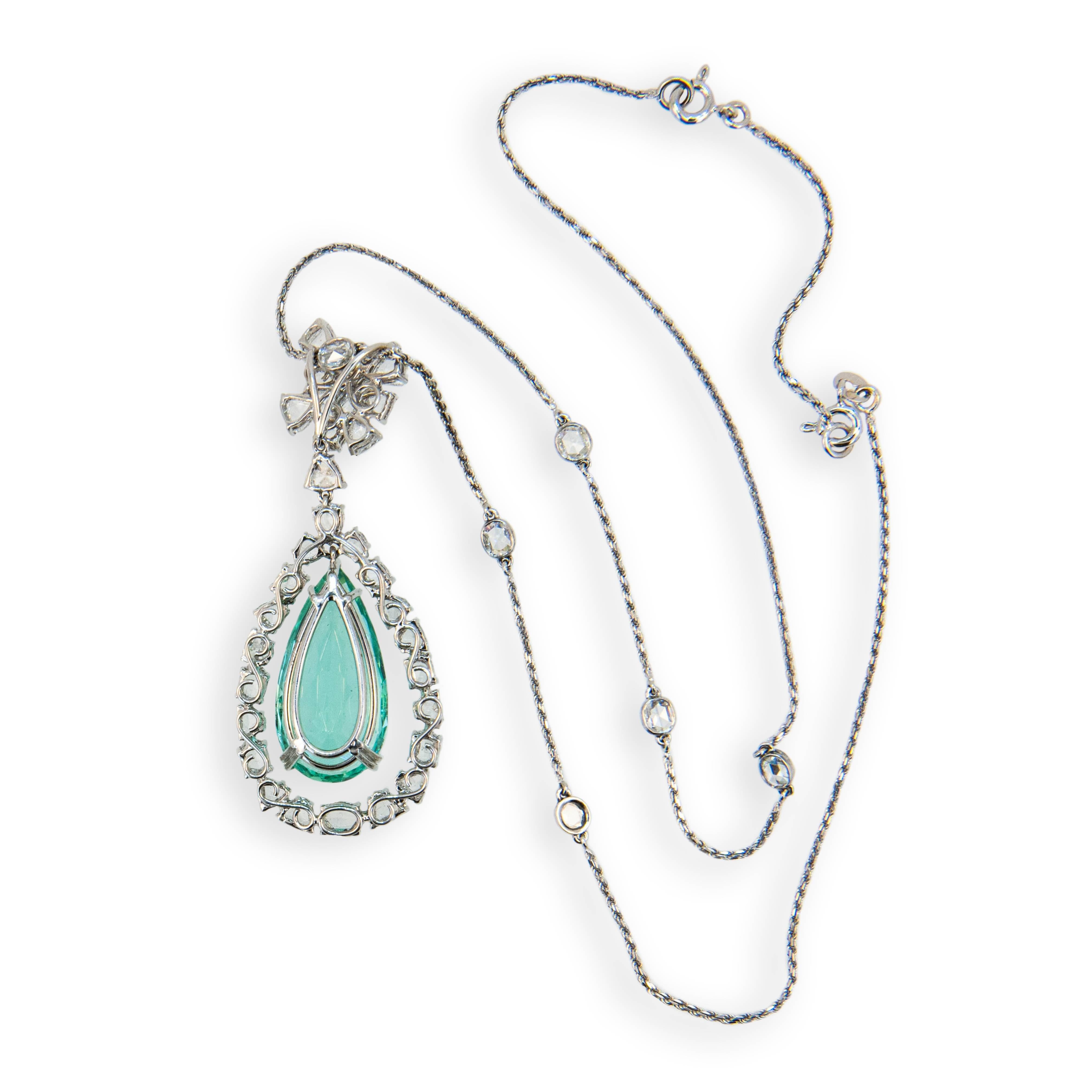 18 karat blackened white gold necklace set with one faceted pear shaped Mint Green Tourmaline 17.94 carats. Set above and around Tourmaline are 30 fancy shaped rose cut diamonds and six oval rose cut diamonds bezel set on chain. Total weight of 36