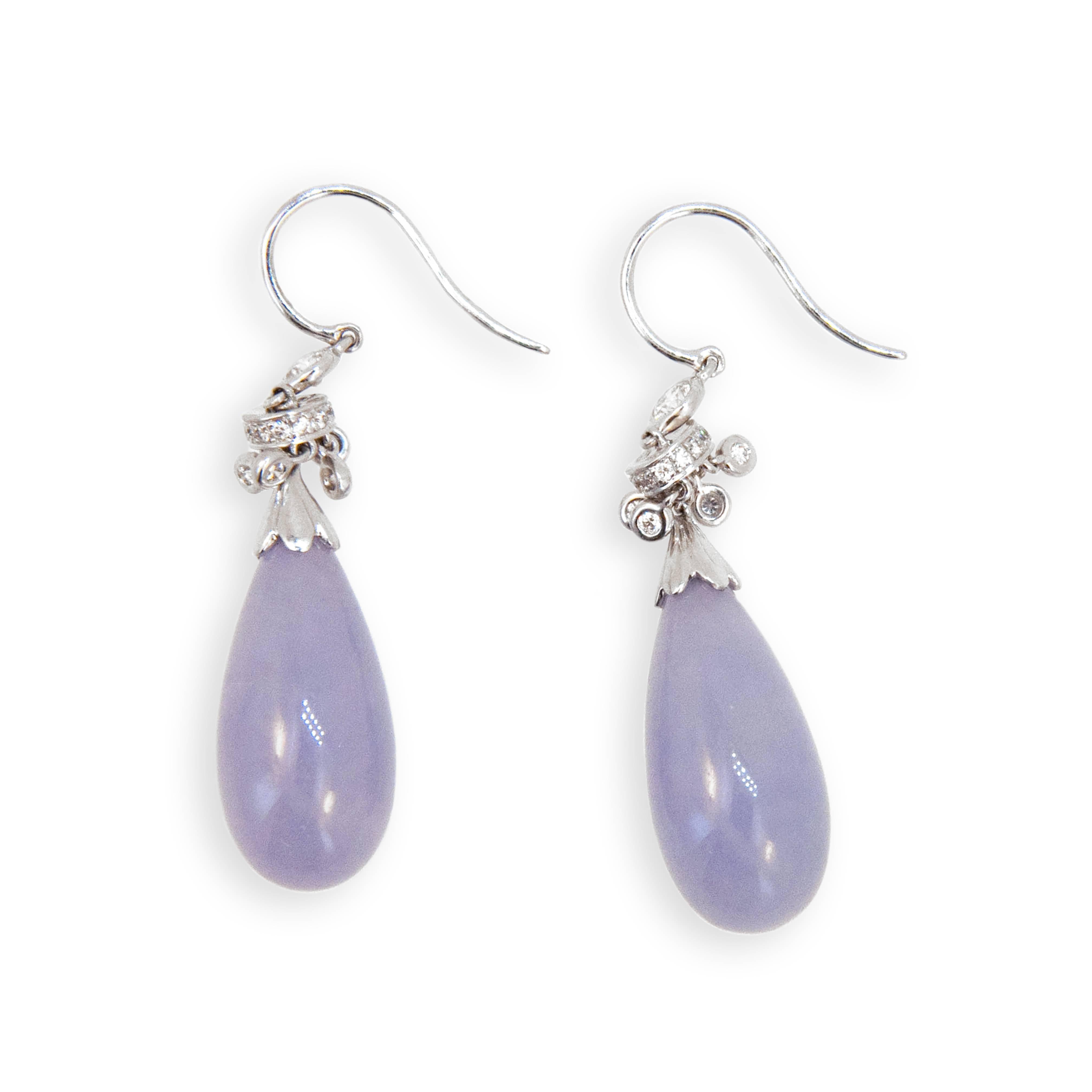 18 karat white gold earrings Lavender Jade drops with Diamond tops each set with 17 full-cut Diamonds 34 weigh .51 carat total weight. 
10 bezel set and 24 set in rondelles. Wires.