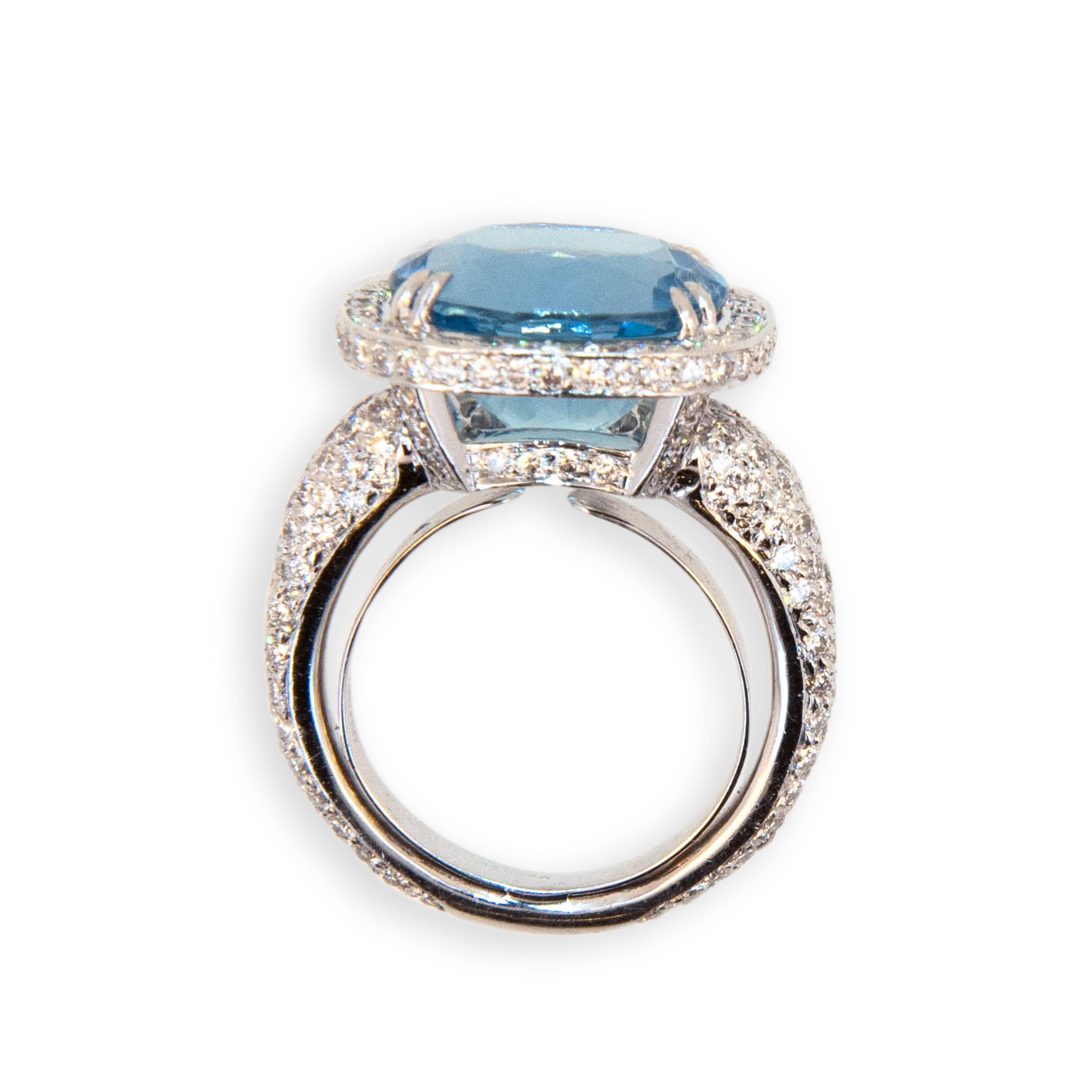 18 karat white gold ring set with Aquamarine 6.70 carats totaL weight. 
218 Round diamonds 1.93 carat total weight. Diamonds set on shank all the way around except on sizing bar at bottom. Diamonds also under bezel beneath aquamarine. Ring is a size