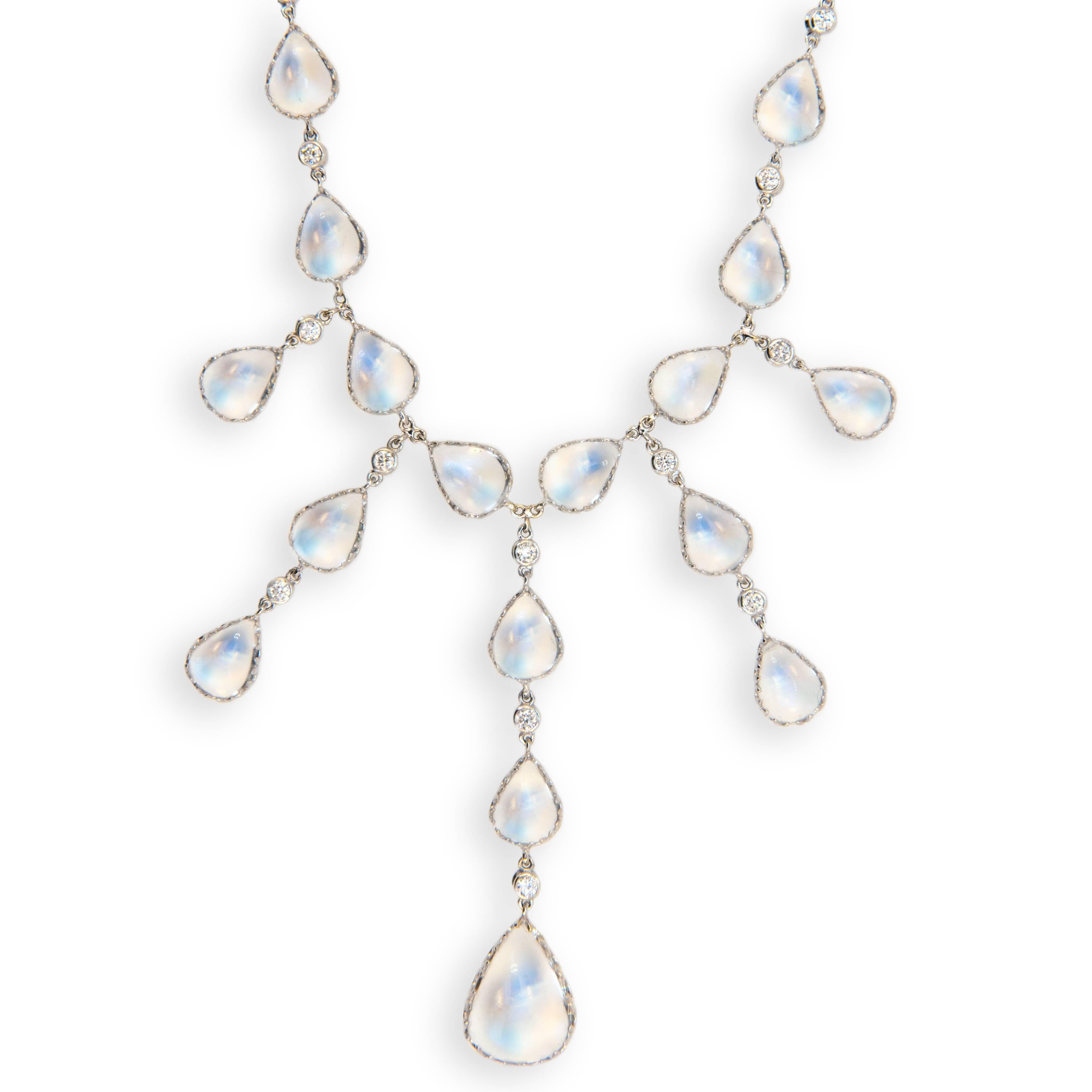 18 karat white gold necklace, Moonstone and diamonds. (38) 8 x 6 mm pear shape moonstones 37.34 carats (1) 13 x 8.8 mm pear shape 3.83 carats and one 7 mm round 1.23 carat at clasp (35) 2 mm round diamonds bezel set 1.01 carats. Necklace is 16.5