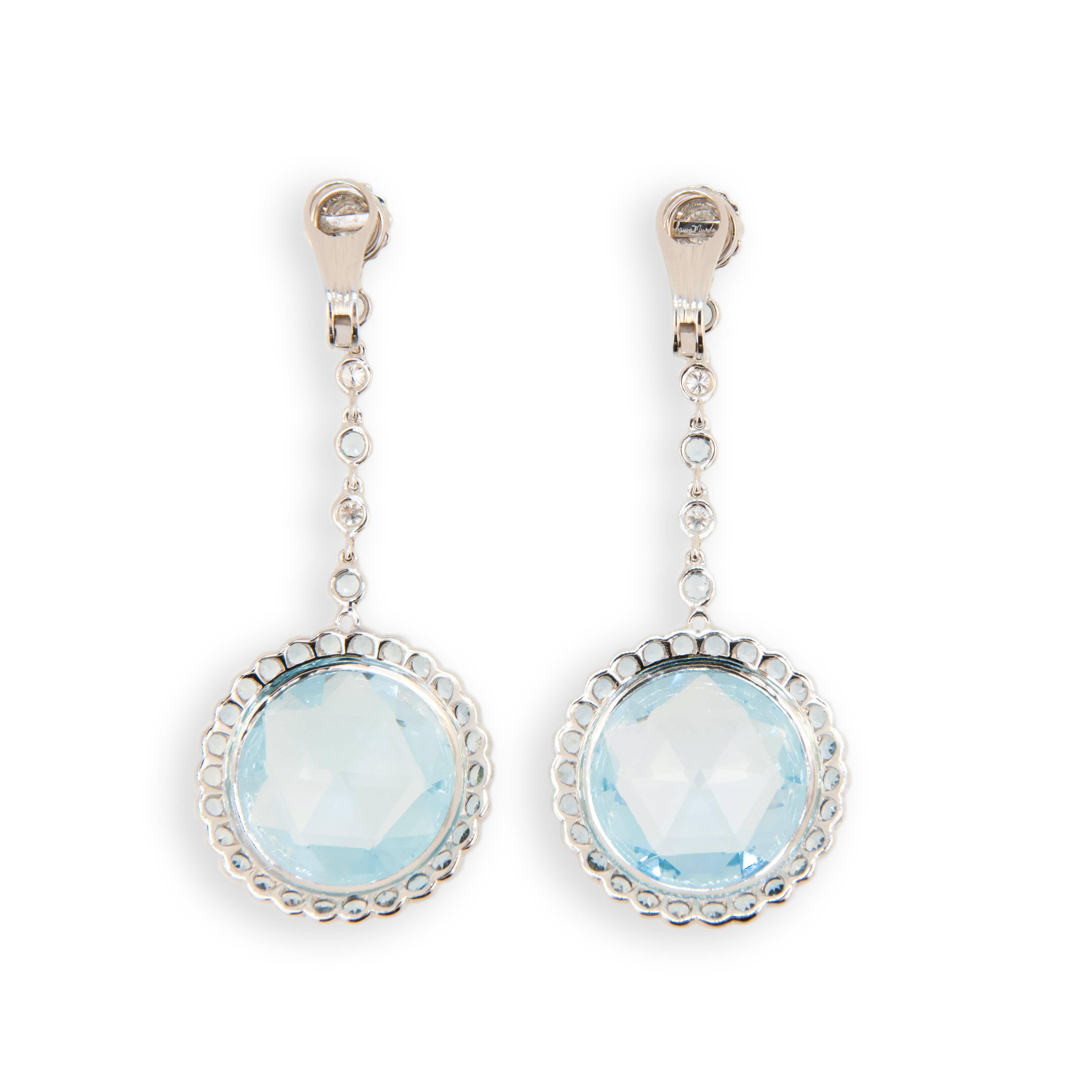 18 karat white gold Blue Topaz, diamond, and aquamarine earrings. Briolette topaz 45.00 carats, Diamonds .78 carat, aquamarine 3.30 carats.