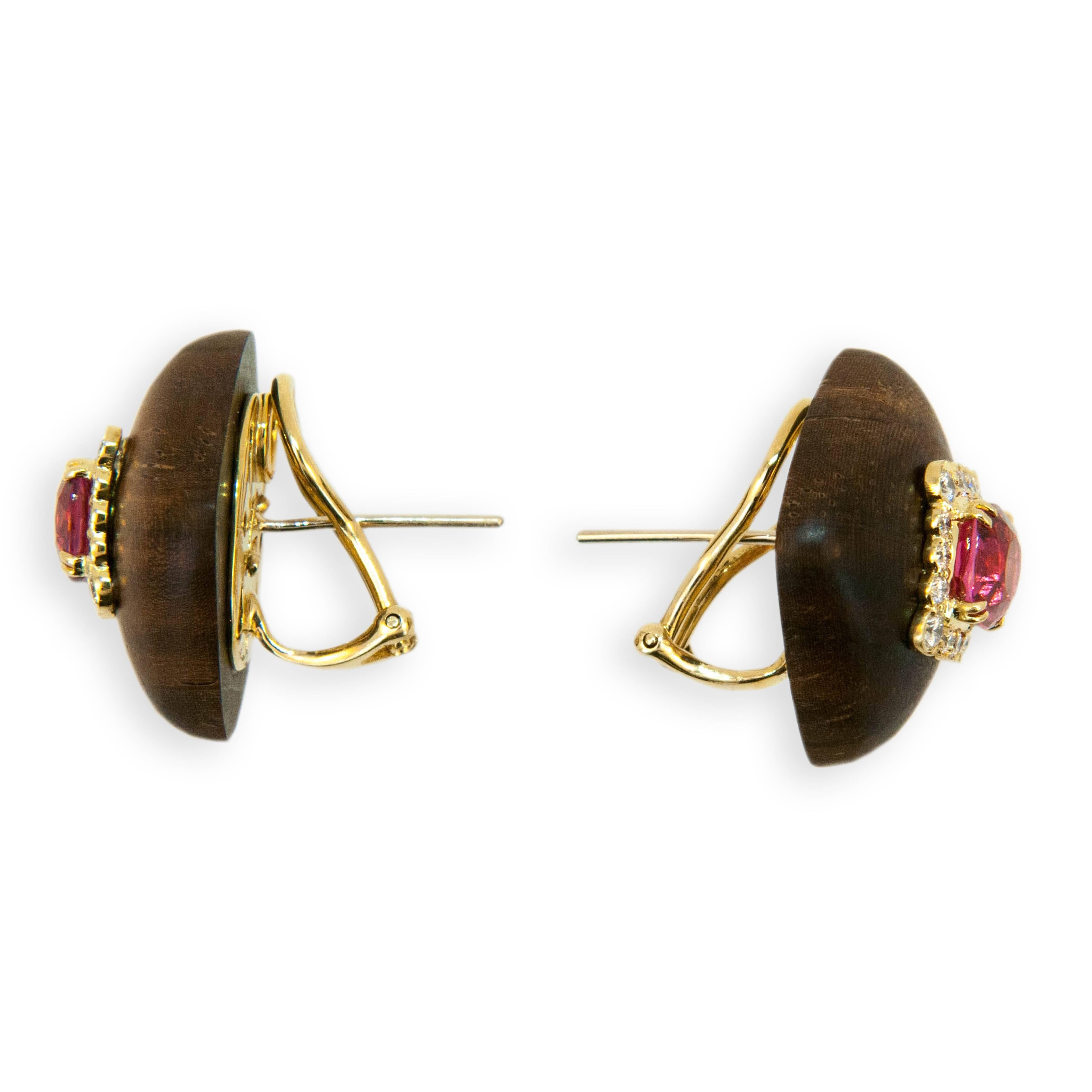 18 karat yellow gold earrings dark wood each set with one Pink Spinel cushion shaped oval (2) Spinel 3.33 carats total weight. Square frame each set with (16) Diamonds (32) Diamonds total .68 carat total weight. Posts and Clips.   