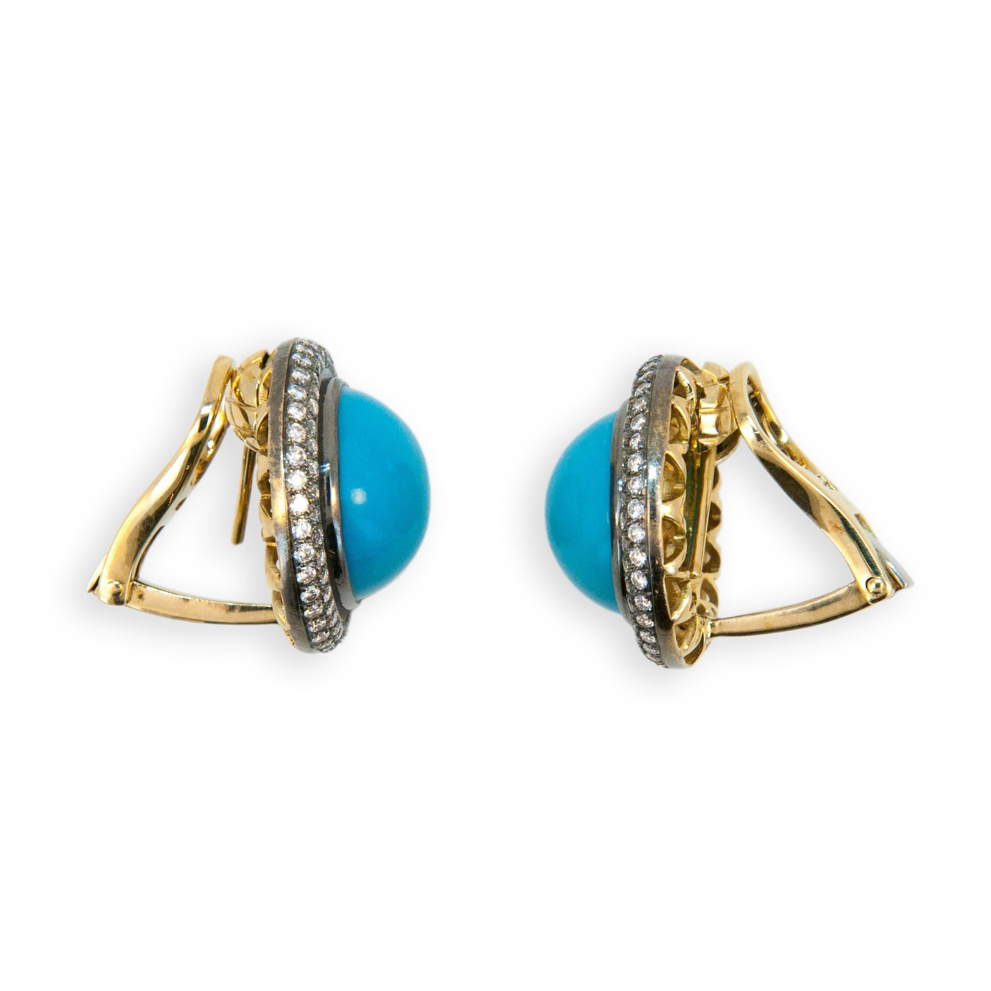18 karat yellow blackened gold turquoise and diamond earrings. Turquoise approximately 21.29 carats total weight. Diamonds approx. 1.59 carats total weight. Turquoise approximately 15 mm in diameter. Earrings can be worn as pierced or clip on posts