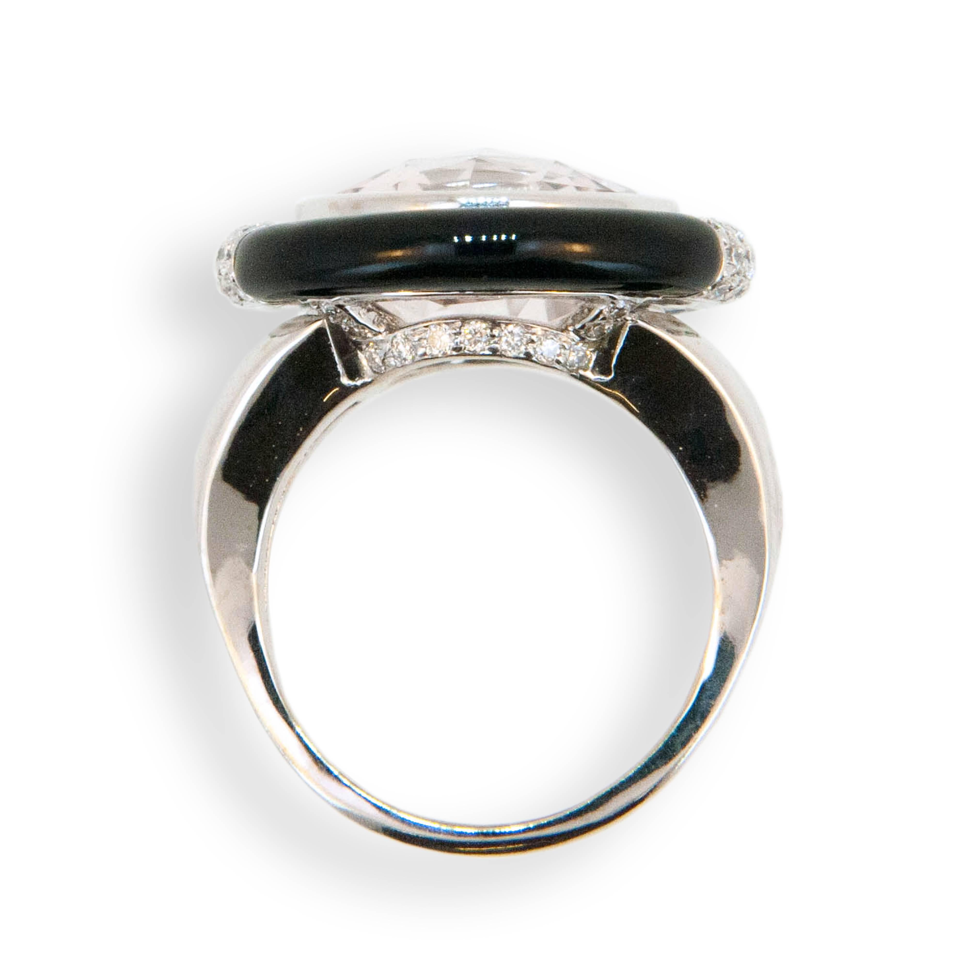 18 karat white gold ring set with one round faceted Morganite 8.65 carats partially surrounded by Black Jade with pave' set diamonds at 3:00 and 9:00 (62) round diamonds .61 carat total weight. Ring is a size 6.75.