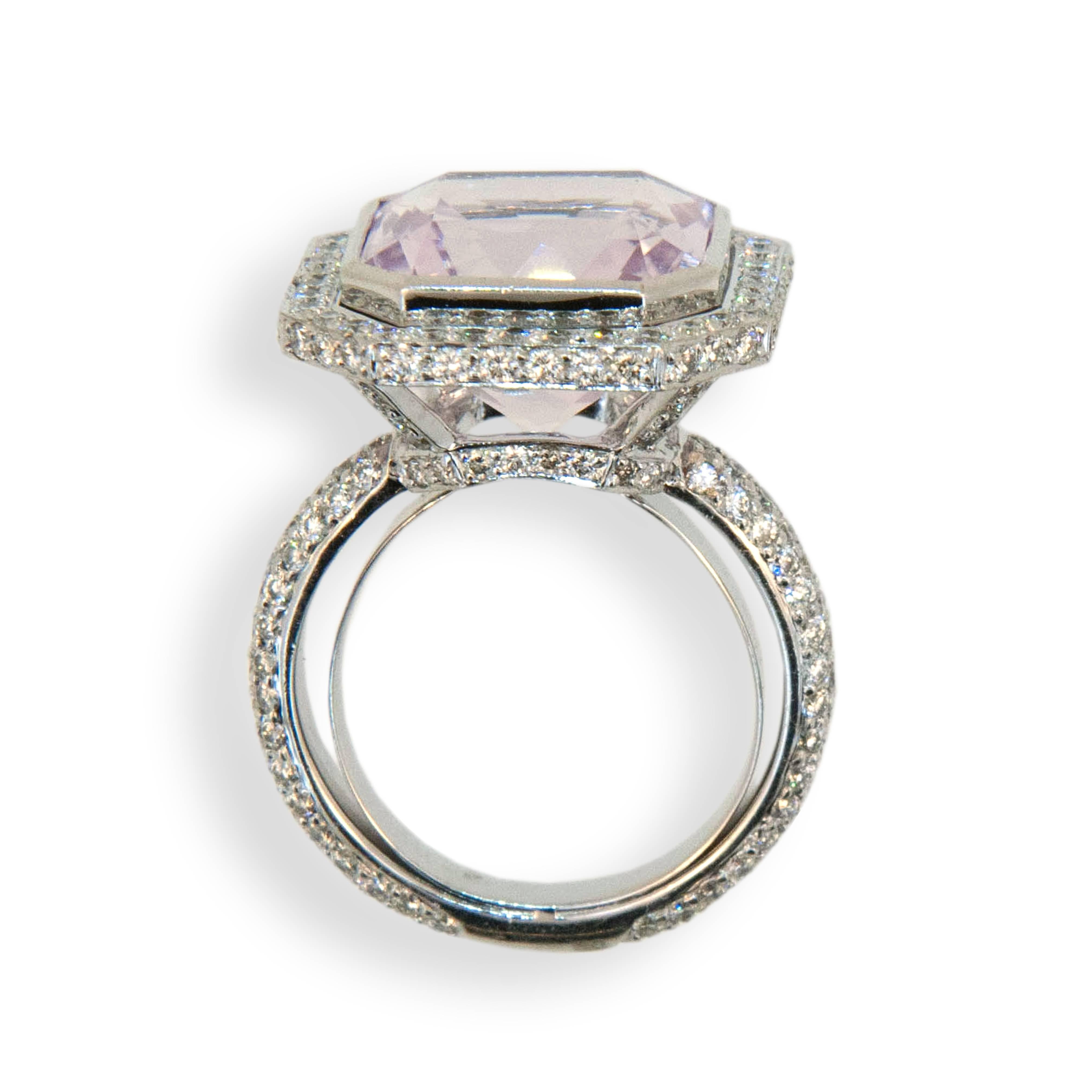 18 karat white gold ring set with an octagonal cut Kunzite 11.49 carats total weight 12.91 mm x 9.17 depth x 15.04 and micro-set with  206 round diamonds 1.97 carats total weight. Ring is a size 6.75 with a horseshoe.
