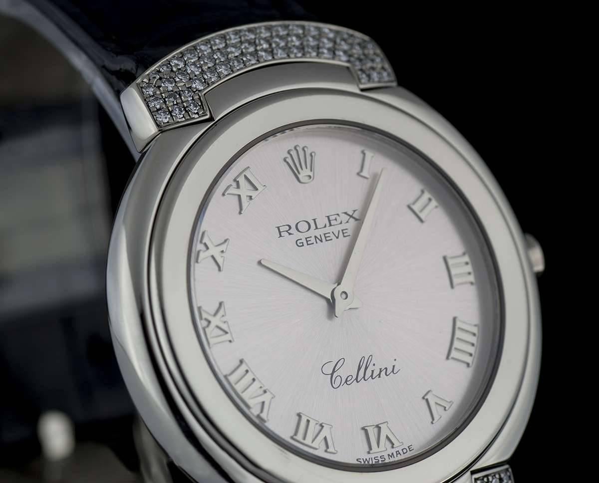 An 18k White Gold Cellini Ladies Wristwatch 6682/9, pink dial with applied white gold roman numerals, lugs have been set with three rows of diamonds (a total of 54 round brilliant diamonds on each lug), an original black leather strap with an