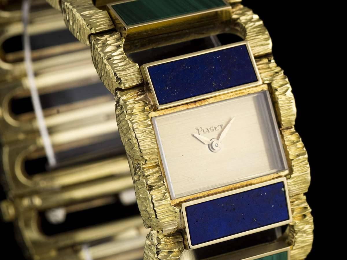 A Rare Lapis Lazuli and Malachite Set Ladies Wristwatch, 23mm, champagne dial, a fixed 18k yellow gold bark finish bezel, an 18k yellow gold bark finish bracelet set with 10 alternating lapiz lazuli panels and 9 malachite panels with an 18k yellow