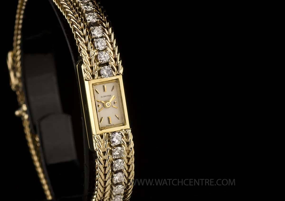 An 18k Yellow Gold Cocktail Ladies Wristwatch, silvered dial with applied index batons, an 18k yellow gold fixed polished bezel, an 18k yellow gold bracelet set with approximately 60 round brilliant cut diamonds with an 18k yellow gold jewellery