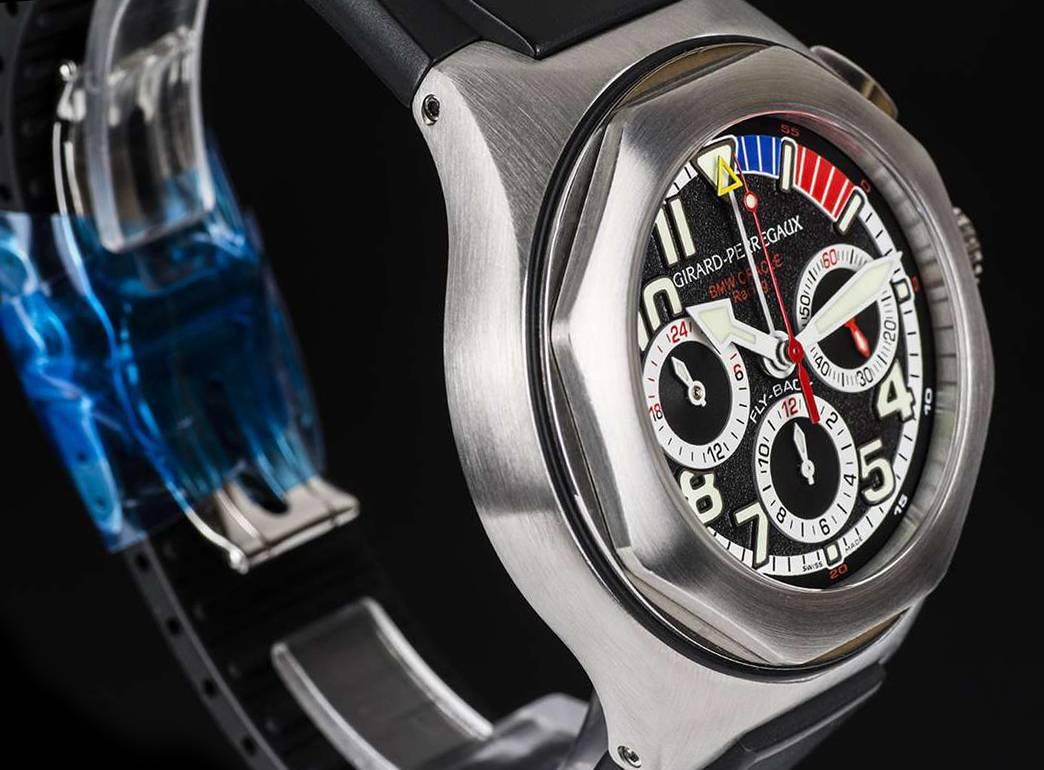 A Titanium BMW Oracle Racing Limited Edition Gents Wristwatch, black dial with arabic numbers and index batons, small seconds at 3 0'clock, 12 hour recorder at  6 0'clock, 24 hour recorder at 9 0'clock, printed minute chapter on outer part of the