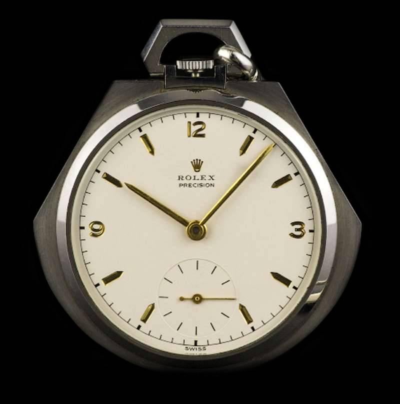 A Very Rare Asymmetrical Shaped Stainless Steel Open Face Pocket Watch Circa 1920, an original engraved cream dial signed Rolex with gilt baton and 3, 6 and 9 arabic numbers, a subsidiary seconds dial at 6 0'clock, plastic glass, exhibition back
