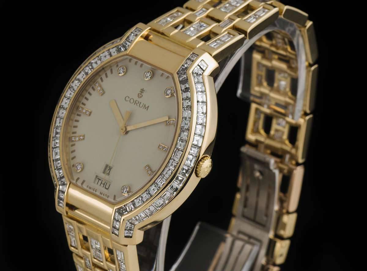 A Gold Gents Dress Wristwatch, cream dial with applied diamond hour markers, date and weekday aperture at 6 0'clock, a gold stepped bezel set with approximately 88 baguette cut diamonds, a Chopard 18k yellow gold bracelet set with approximately 112