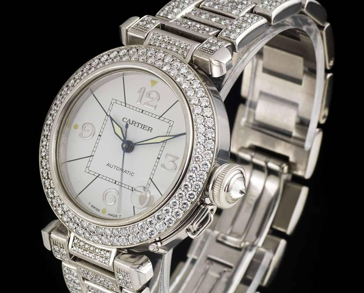 A White Gold Fully Loaded Diamond Set Pasha Ladies Wristwatch, silver dial with applied arabic numbers 3, 6, 9 and 12, date between 4 and 5 0'clock, a white gold bezel set with approximately 100 round brilliant cut diamonds, a white gold screw down