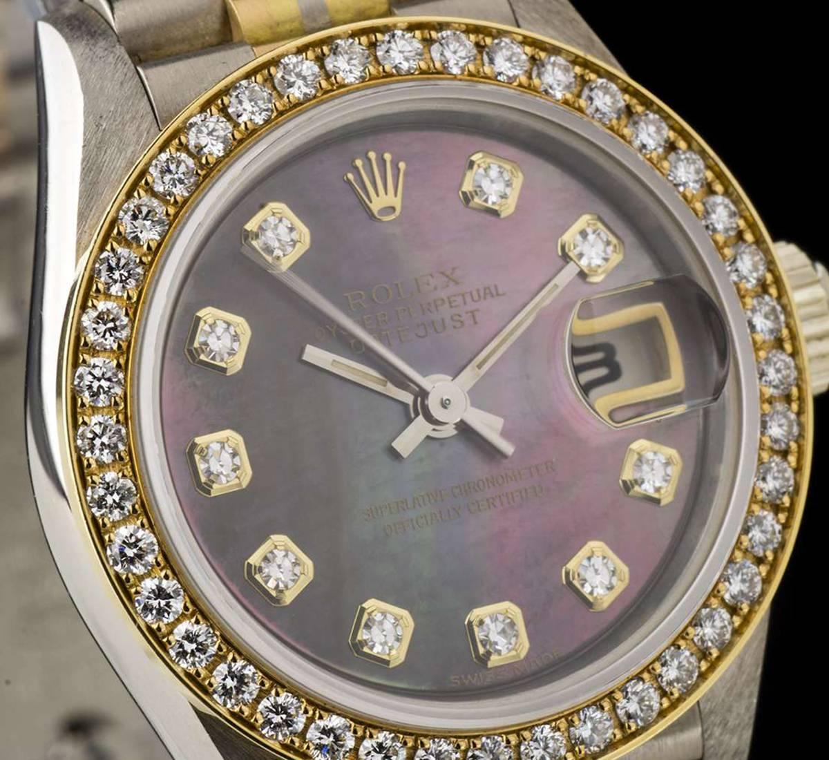 An Unworn Tridor Oyster Perpetual Datejust Ladies NOS Wristwatch, black mother of pearl dial with 10 applied round brilliant cut diamond hour markers, date at 3 0'clock, a fixed yellow gold bezel set with approximately 40 round brilliant cut