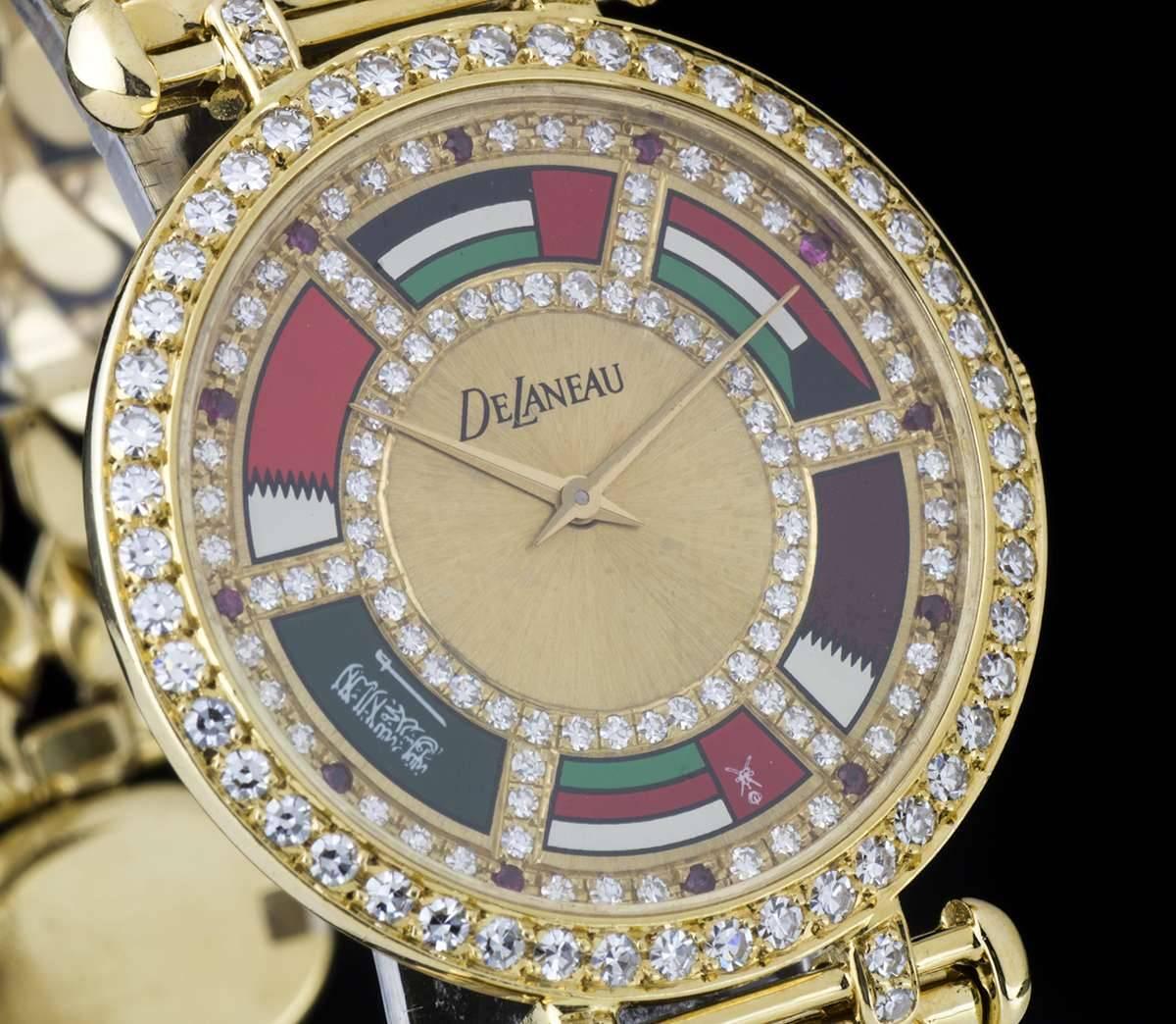 A Gold Middle Eastern Flags Gents Dress Wristwatch, champagne dial set with approximately 90 round brilliant cut diamonds and 12 round brilliant cut ruby hour markers, United Arab Emirates flag between 11 and 1 0'clock, Kuwait flag between 1 and 3