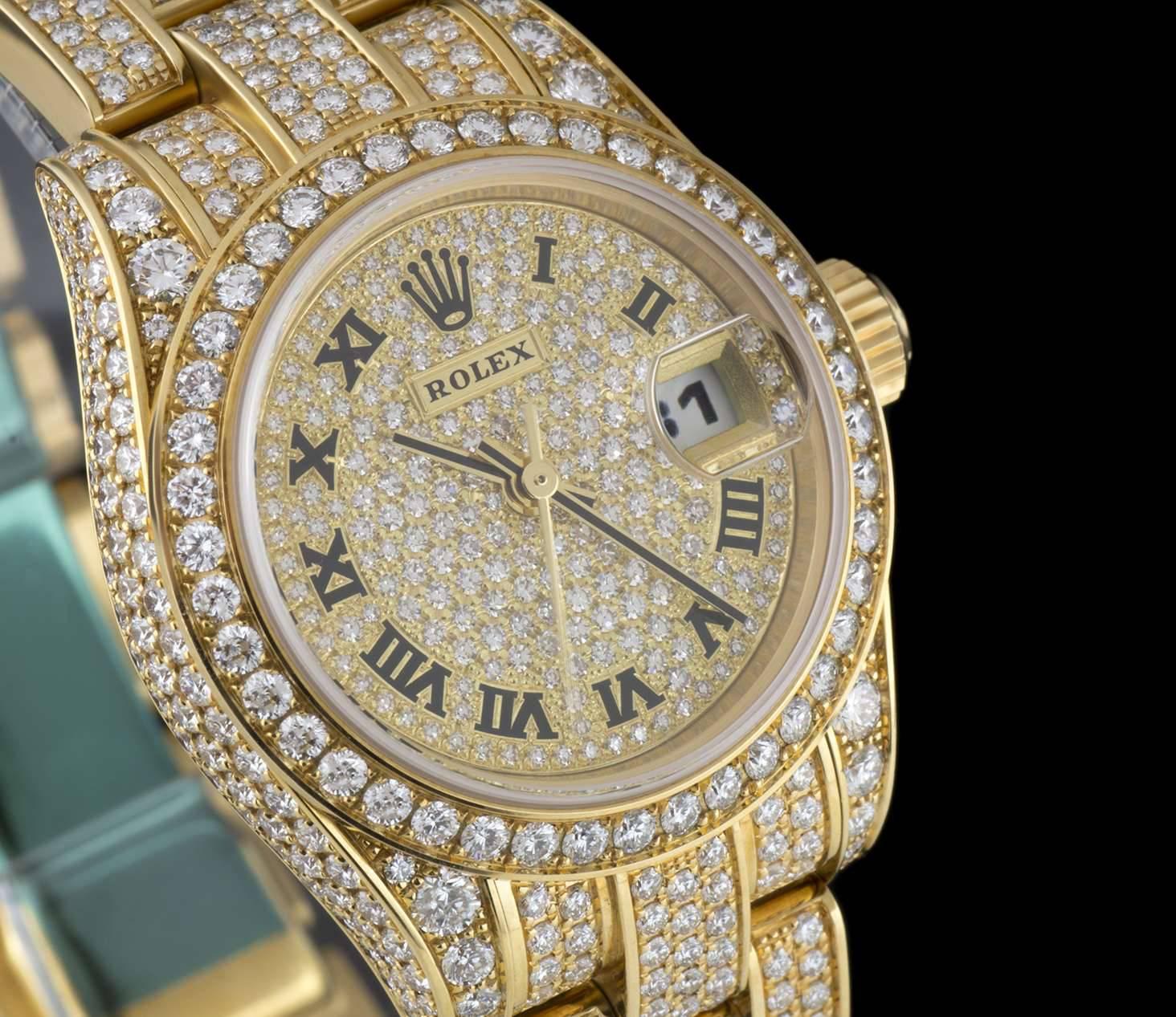 An Unworn Yellow Gold Fully Loaded Oyster Perpetual Datejust NOS Ladies Wristwatch, pave diamond dial with applied roman numerals, date at 3 0'clock, a fixed yellow gold bezel set with approximately 42 round brilliant cut diamonds (~0.66ct), a