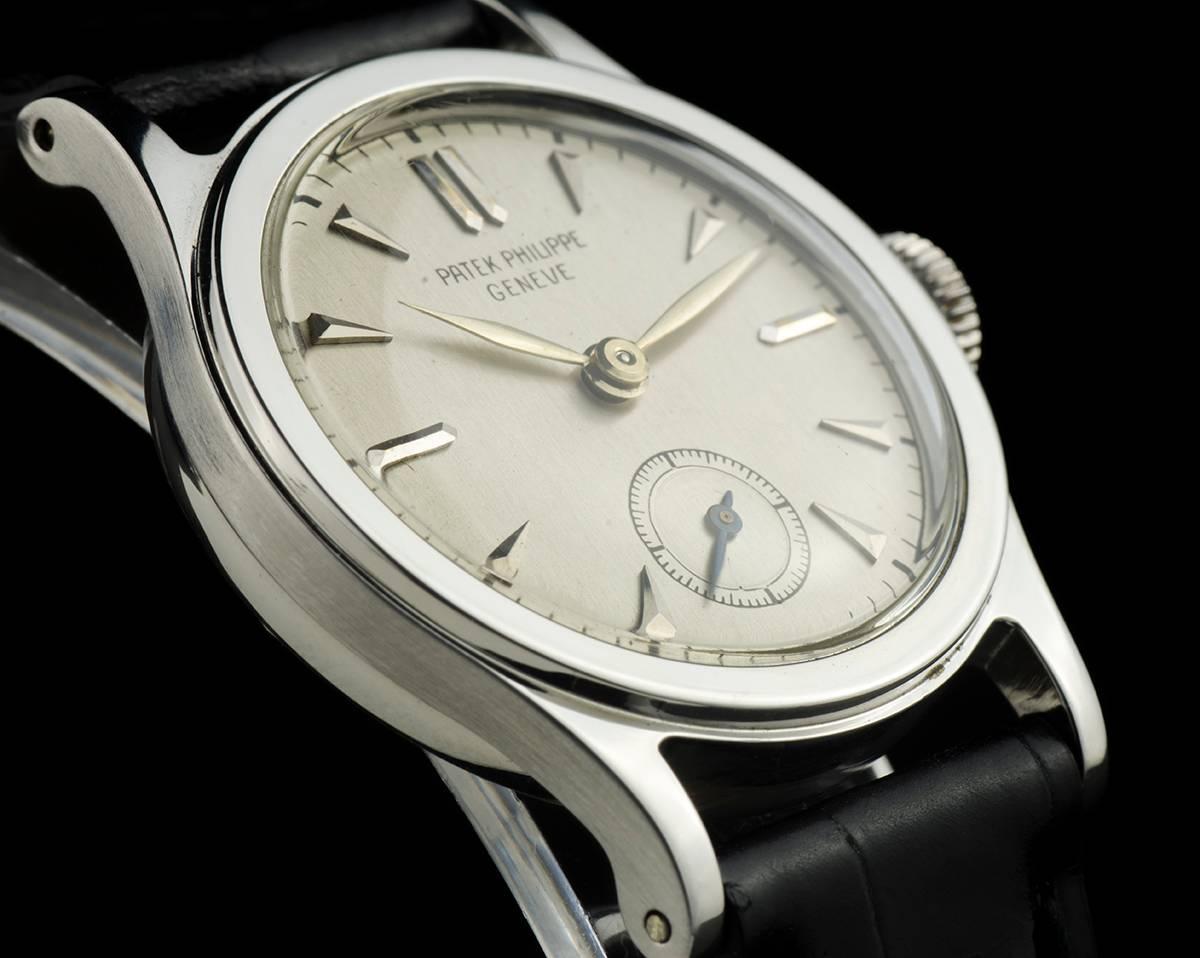 A Rare Steel Vintage Gents Dress Wristwatch, silver dial with applied hour markers, small seconds at 6 0'clock, a fixed steel bezel, a brand new original black leather strap with an original steel pin buckle, plastic glass, manual wind movement,