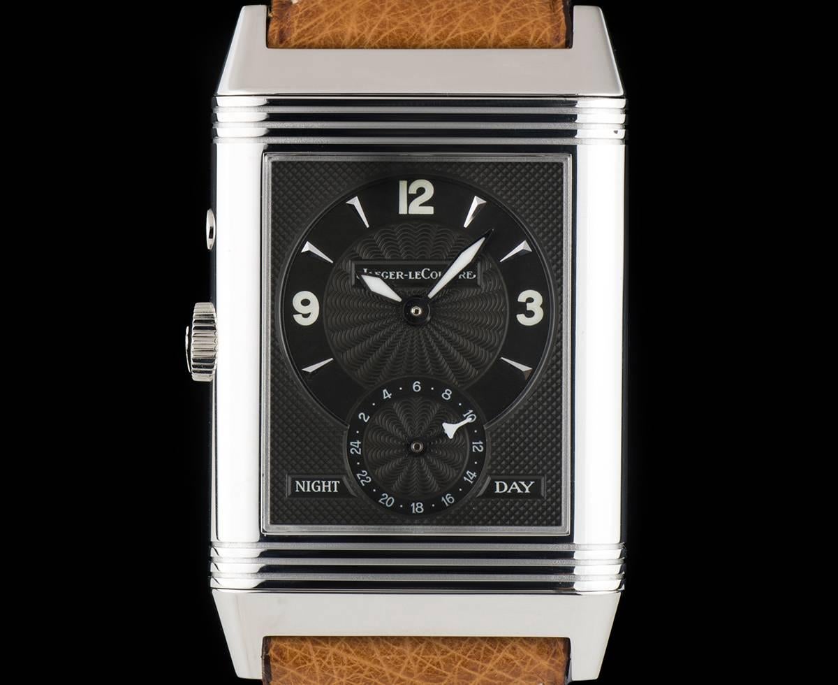 A Stainless Steel Reverso Gents Wristwatch, silvered dial with arabic numbers, small seconds at 6 0'clock, reverse black dial with applied hour markers and arabic numbers at 3, 9 and 12 0'clock, day/night 24 hour indicator at 6 0'clock, a fixed