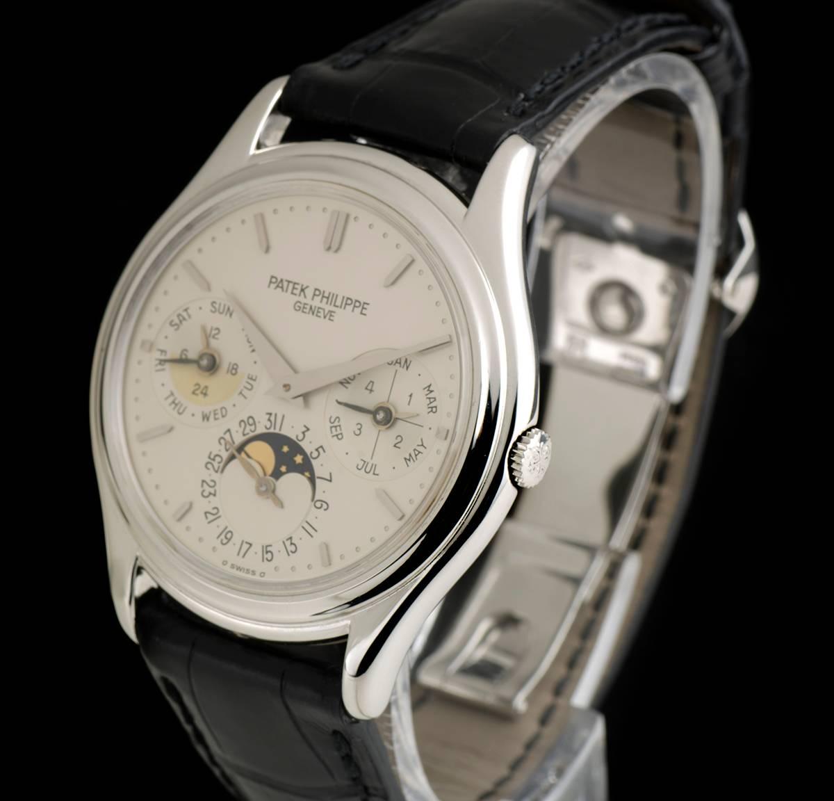 A Platinum Perpetual Calendar Gents Wristwatch, silvered dial with applied hour markers, month aperture with a leap year indicator at 3 0'clock, moonphase and date display at 6 0'clock, weekday and 24 hour display at 9 0'clock, a fixed platinum