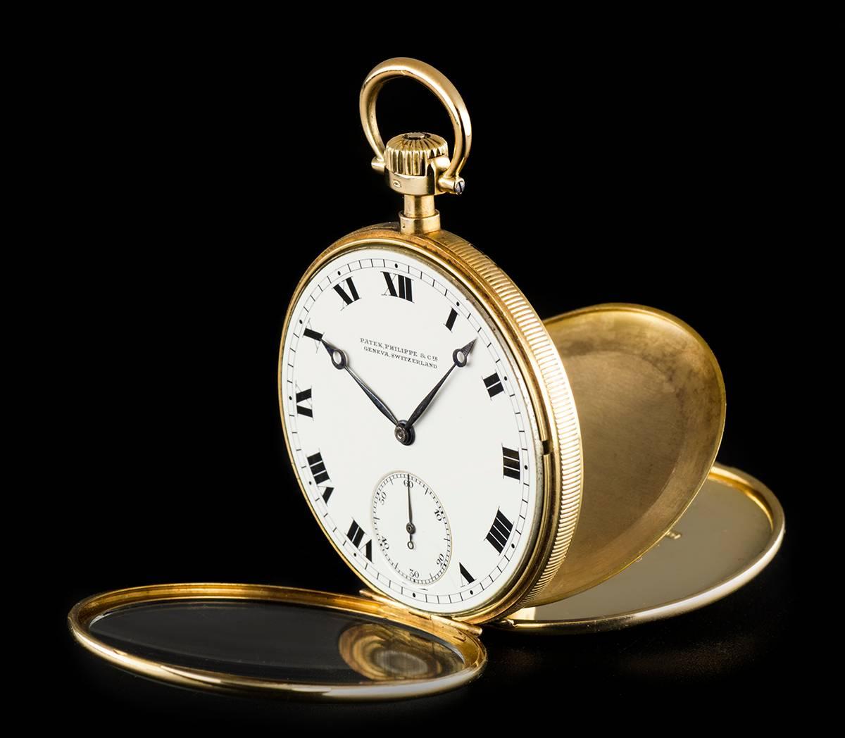 An 18k Yellow Gold Open Face Pocket Watch, white dial with roman numerals, small seconds at 6 0'clock, a fixed 18k yellow gold bezel and case, an 18k yellow gold inner cuvette case engraved with "By Patek Philippe, Made For Green Leaf-Crosby